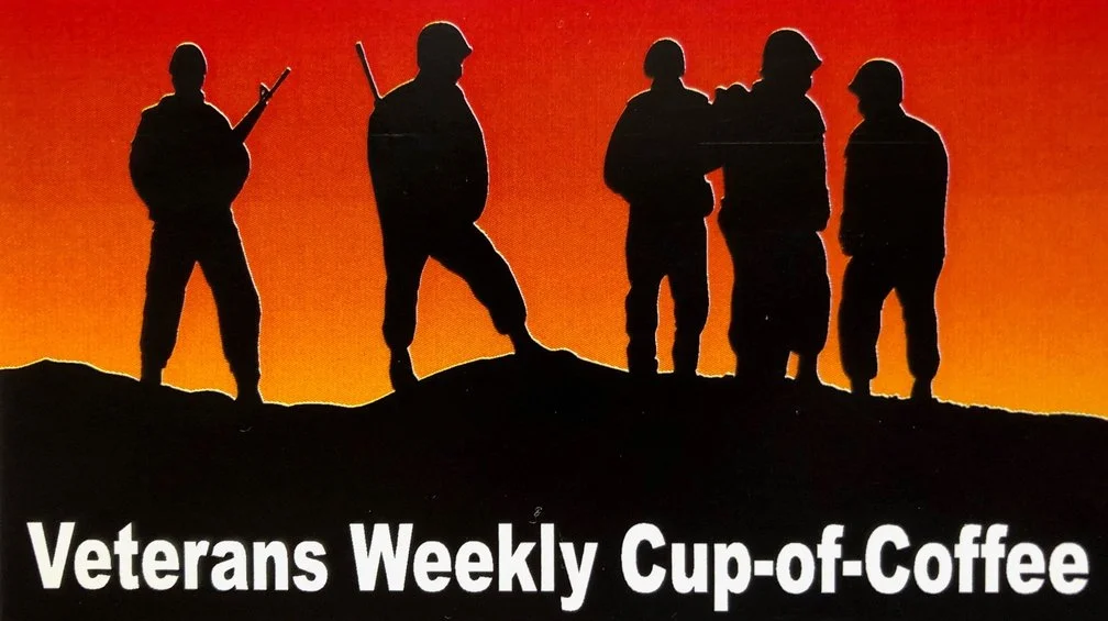 Silhouettes of soldiers standing on a hill against an orange sunset background, with the text "Veterans Weekly Cup-of-Coffee" at the bottom.