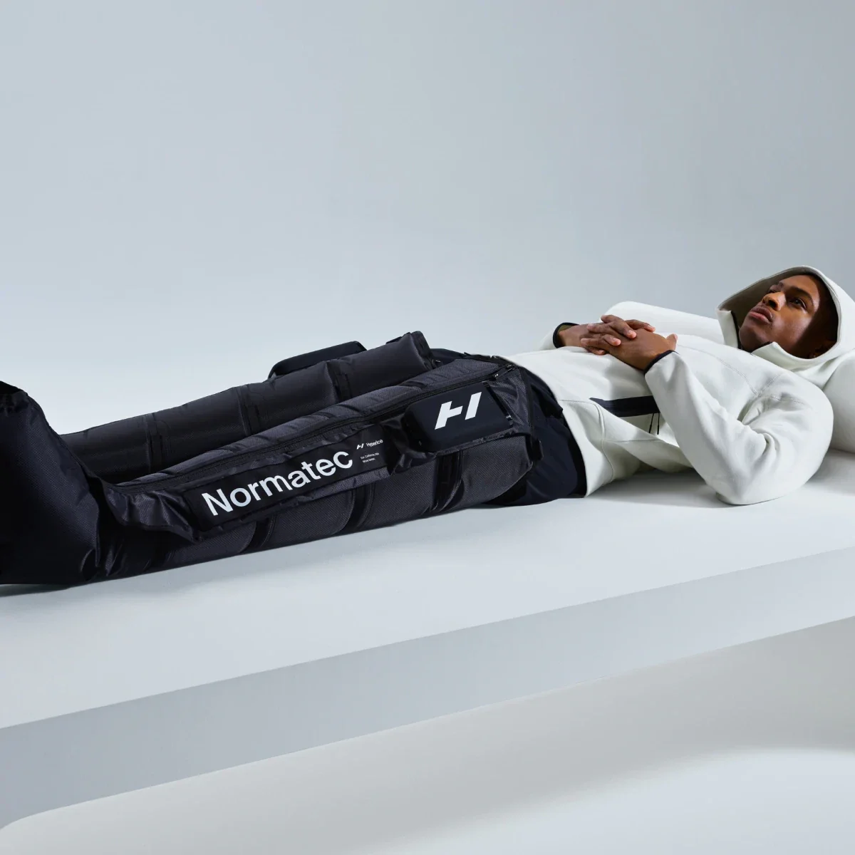 A man receiving compression therapy with Normatec Compression Therapy.