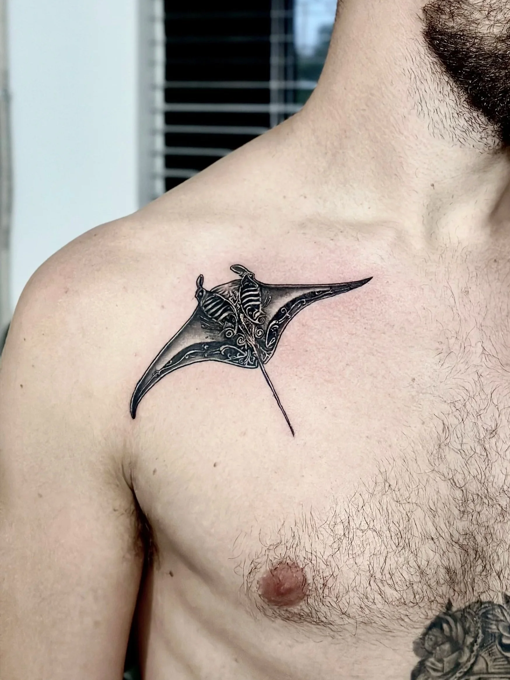 manta ray tattoo on chest