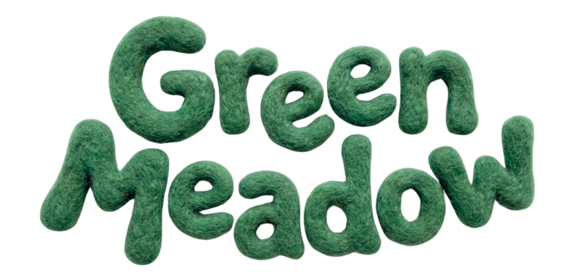 Text saying "Green Meadow" in large, green, pillow-like letters.