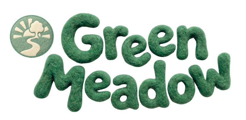 Green text spelling out "Green Meadow" with a small circular logo of a stylized tree and sunlight rays in the top left corner.