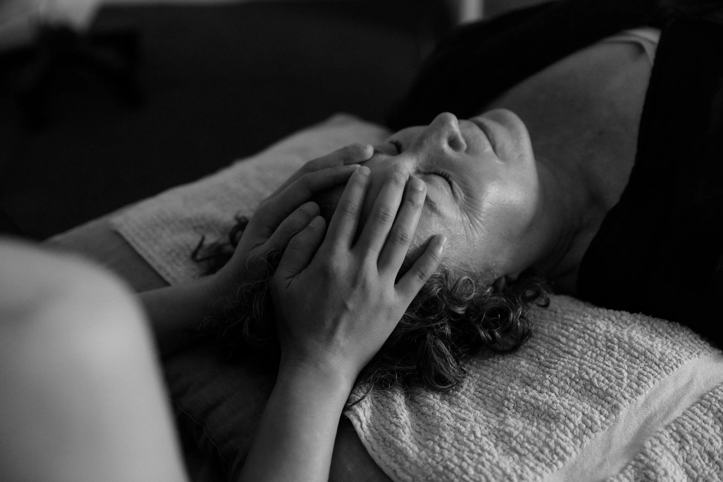 Person receiving a CranioSacral therapy. remedial massage, headache, neck pain, relax, restorative, calm, pain management.