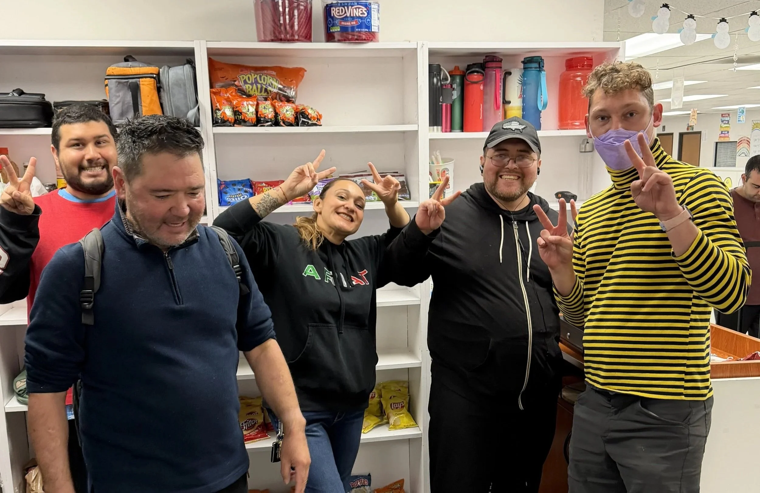 Smiling group in a community program space showing inclusion and connection