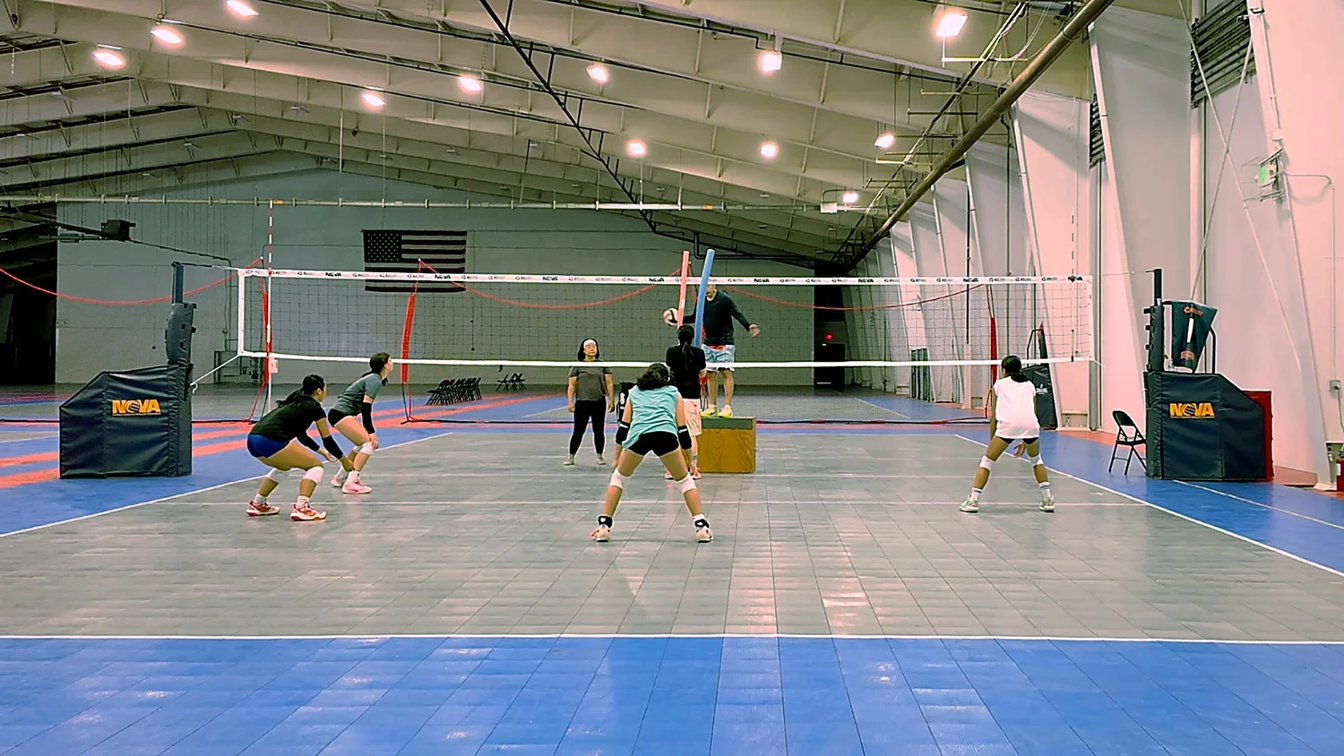 Coach Chris working with athletes during an existing MAH volleyball training session in Sacramento