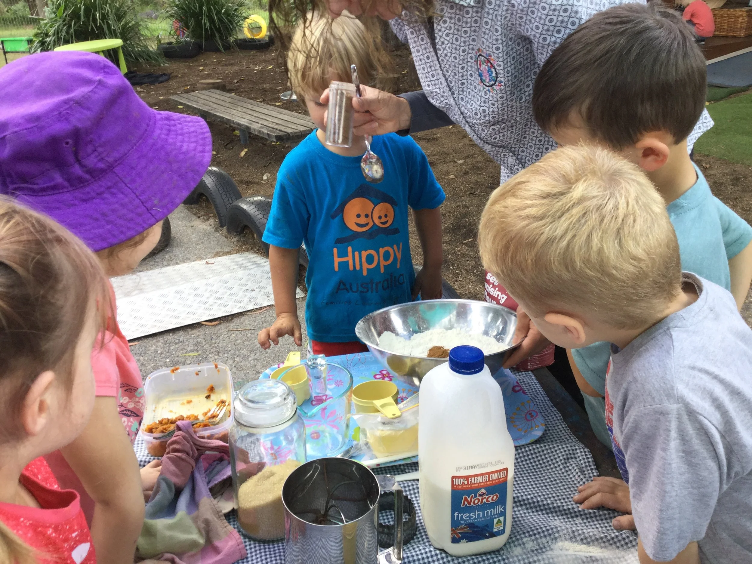 Children participating in a hands-on cooking and sensory learning experience at South West Rocks Preschool.