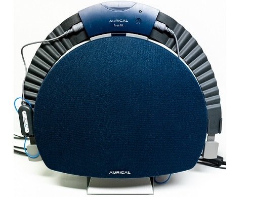 A blue circular medical or diagnostic device with attached cables and a control panel, labeled 'AURICAL FreeFit'.