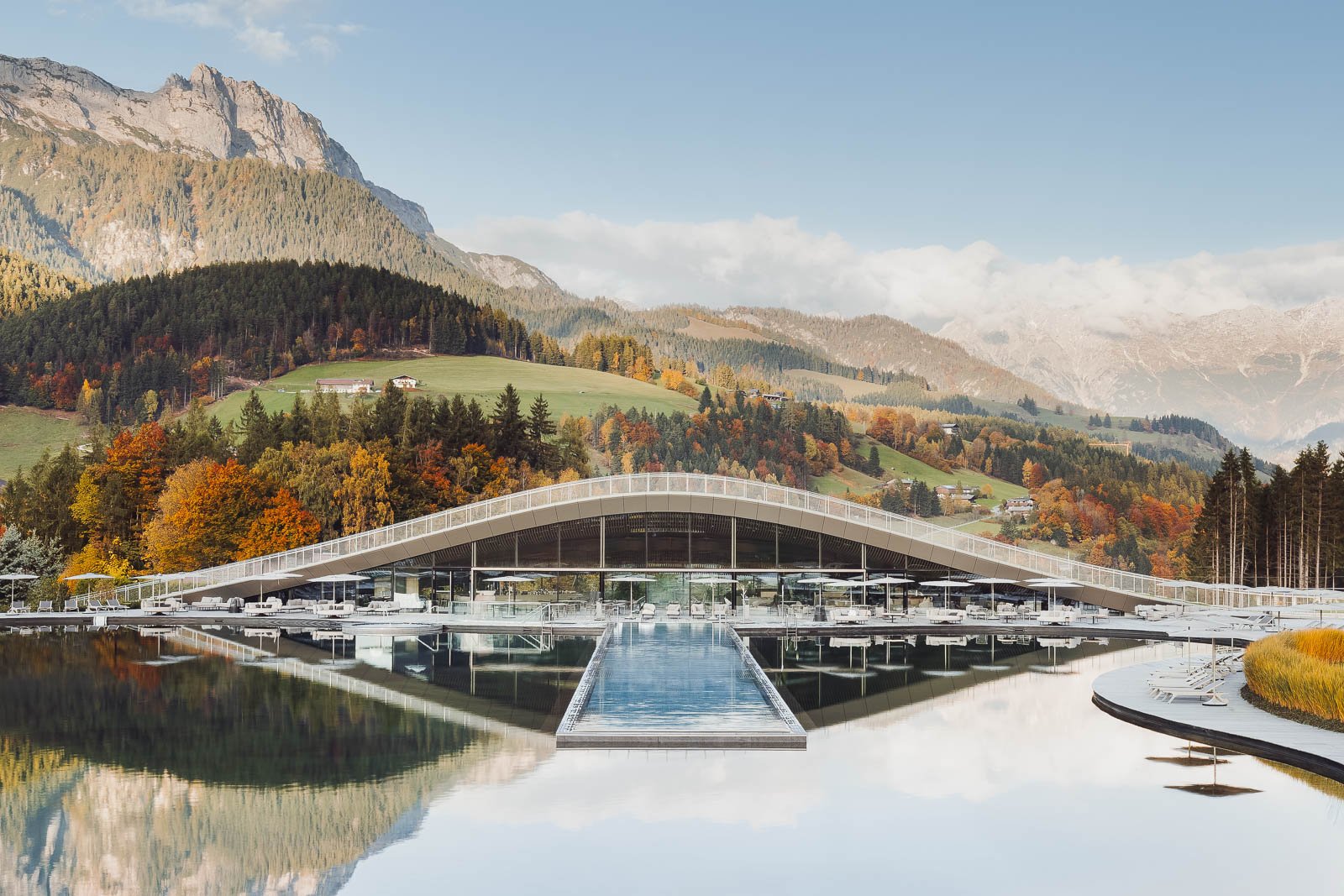 Krallerhof ATMOSPHERE Spa interior with pool reflecting surrounding mountains.