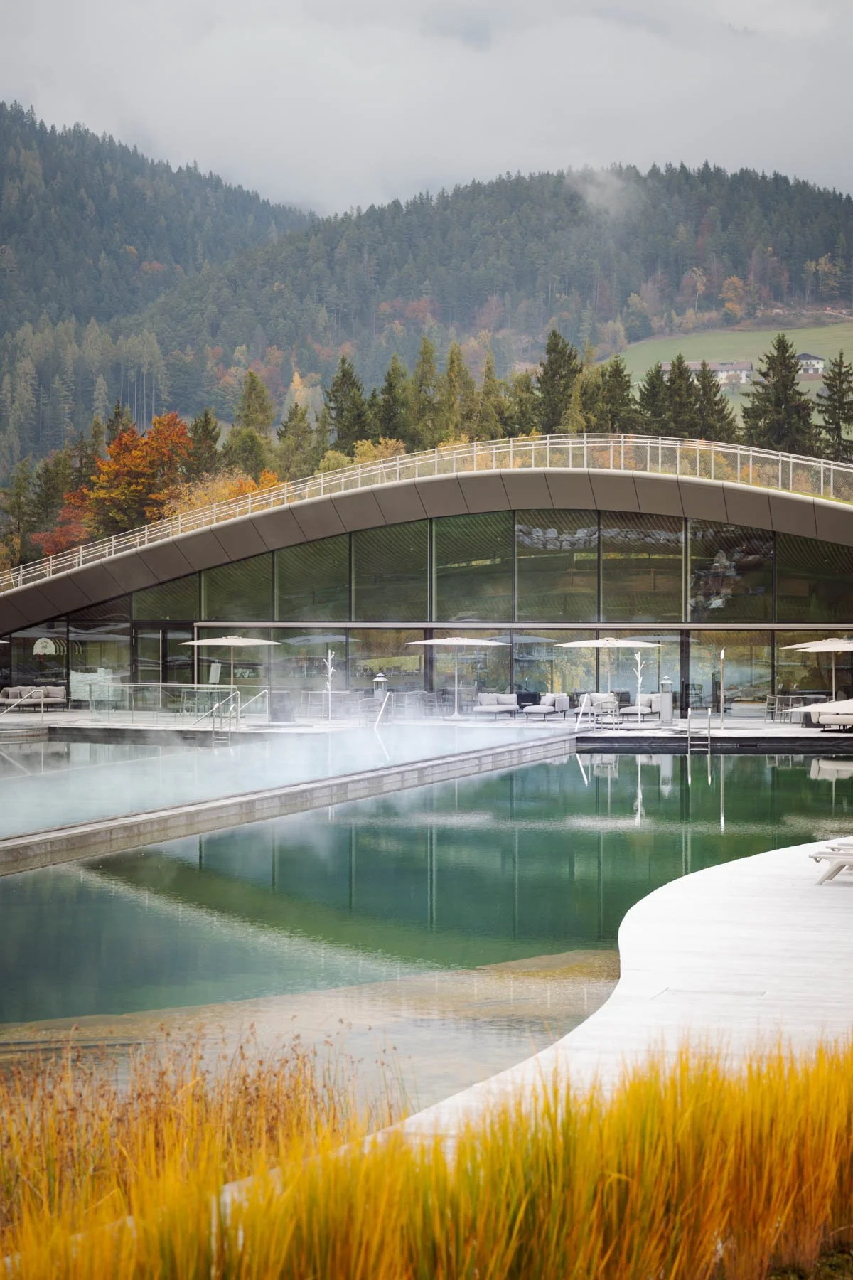 Side view of spa pool and interior, harmoniously blending with nature.