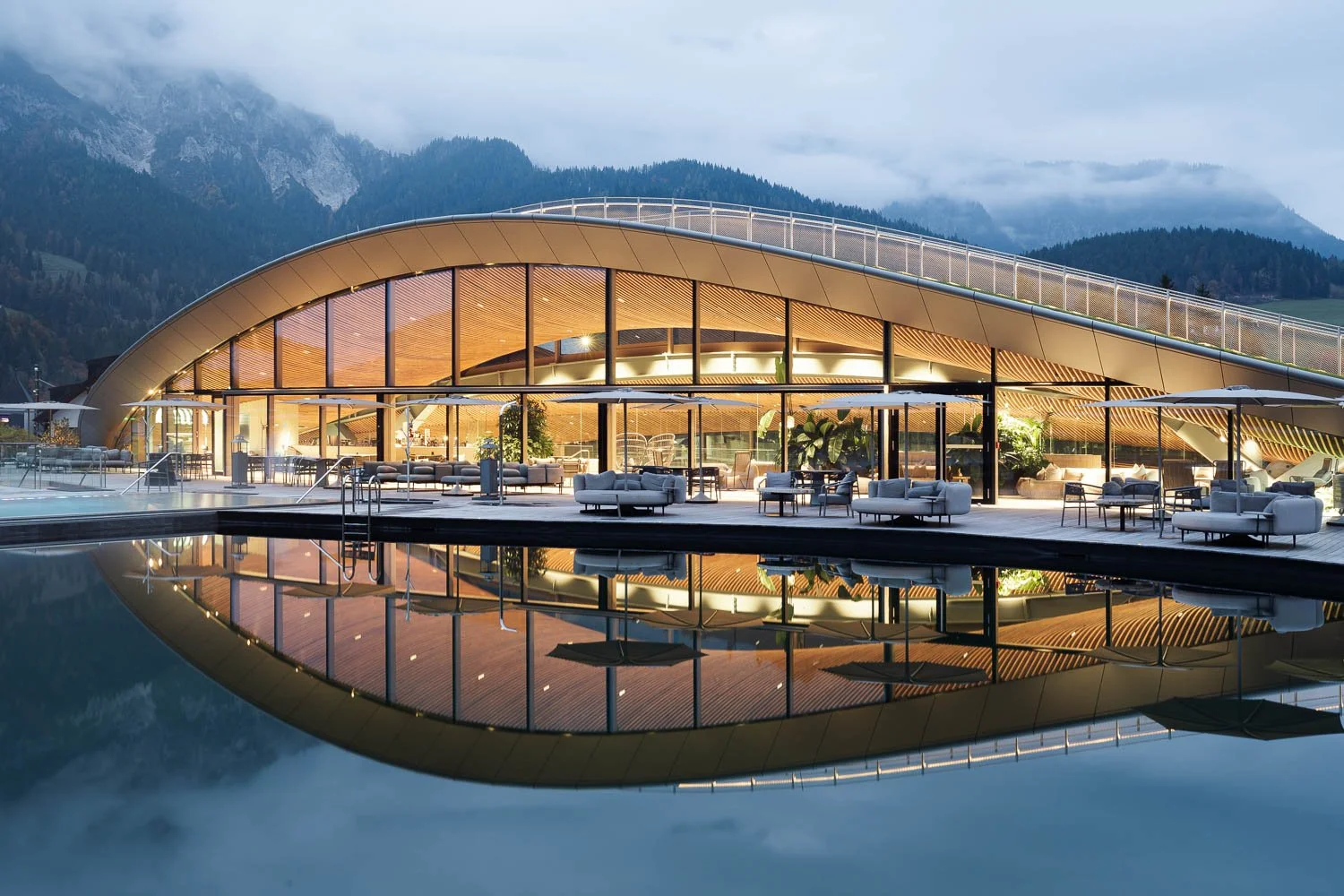 Relaxation area with design pool and soft evening light.