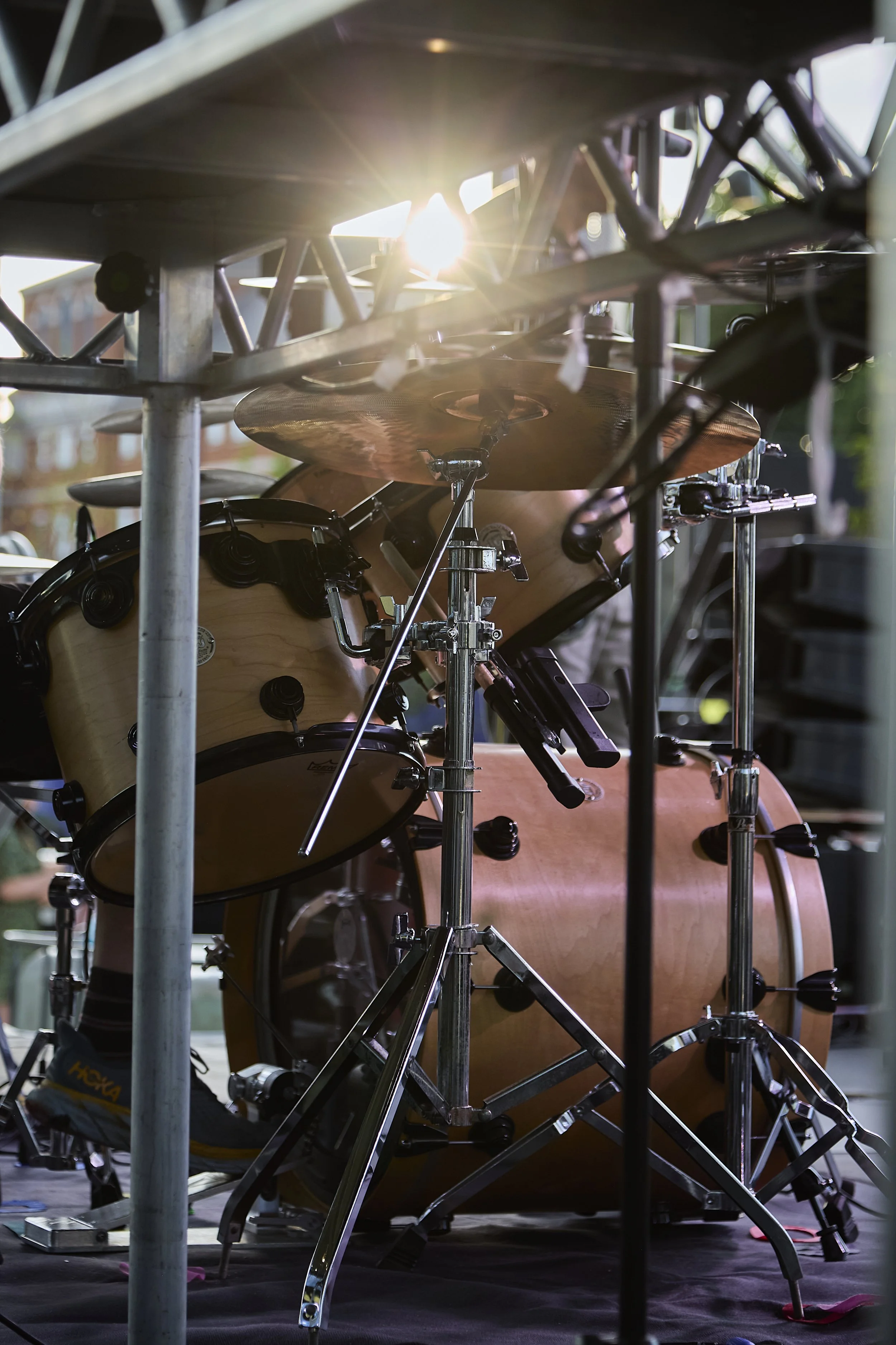 Session drummer Simon Barbour's DW Collectors kit is framed by an outdoor stage and a setting sun