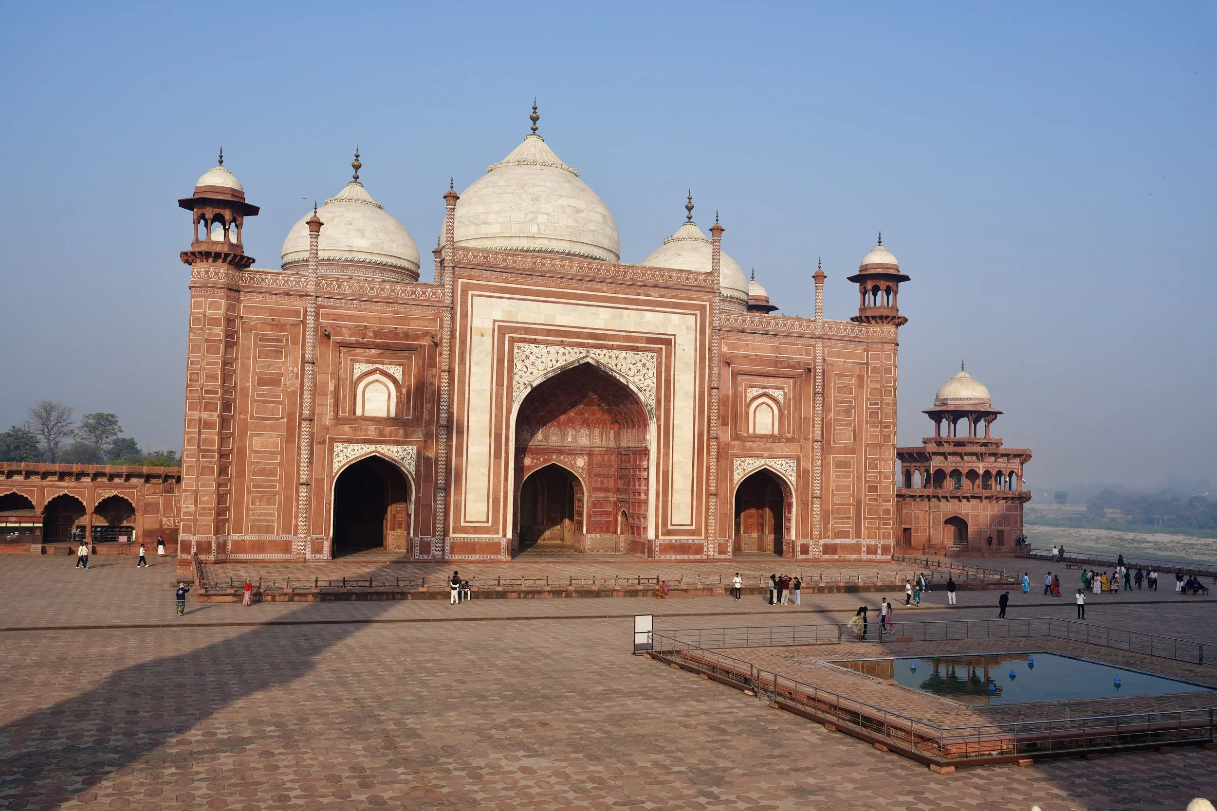 Red sandstone mosque at the Taj Mahal complex in Agra, India
