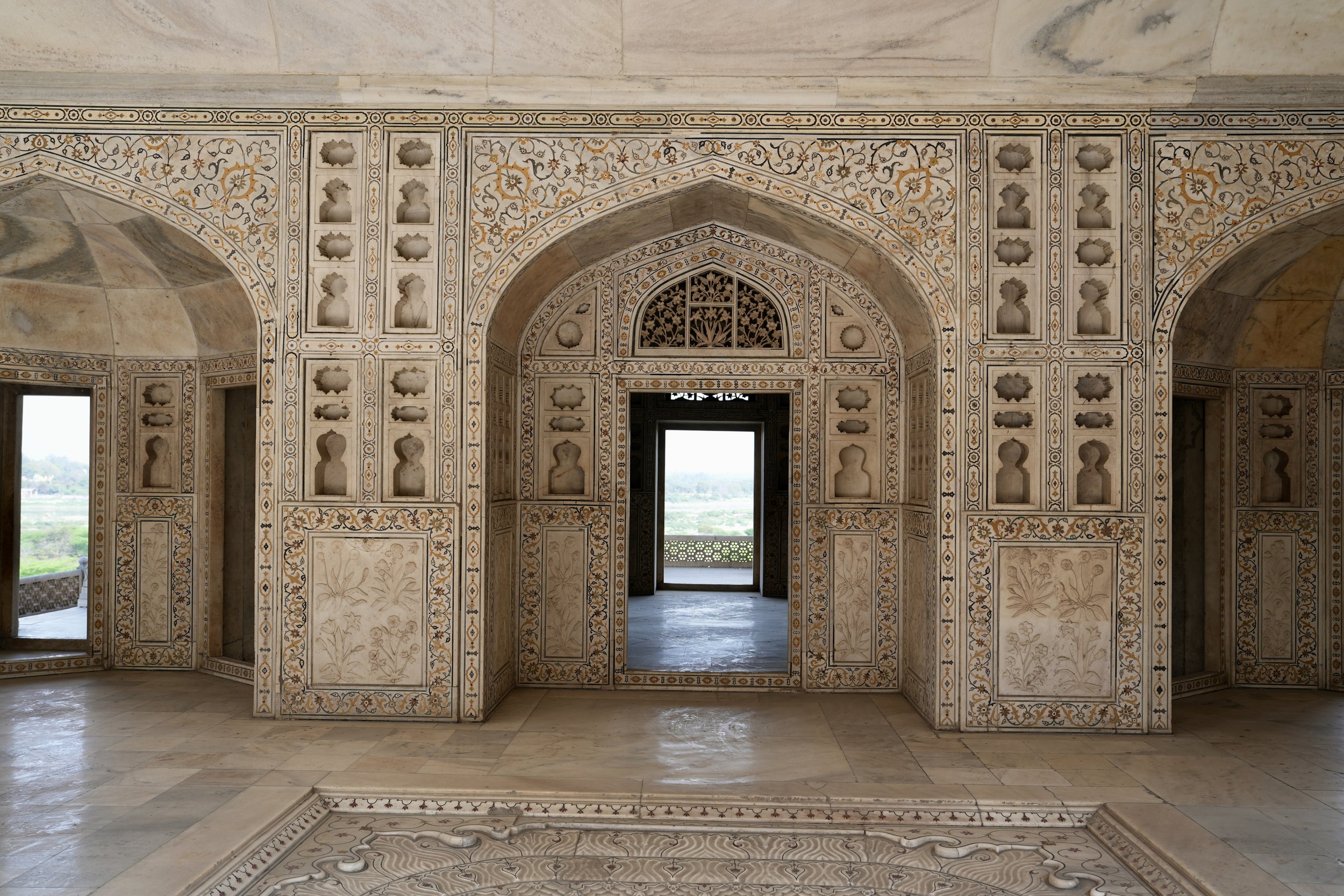 Marble palace inside Agra Fort with carved screens, arches and decorative inlay from Mughal period
