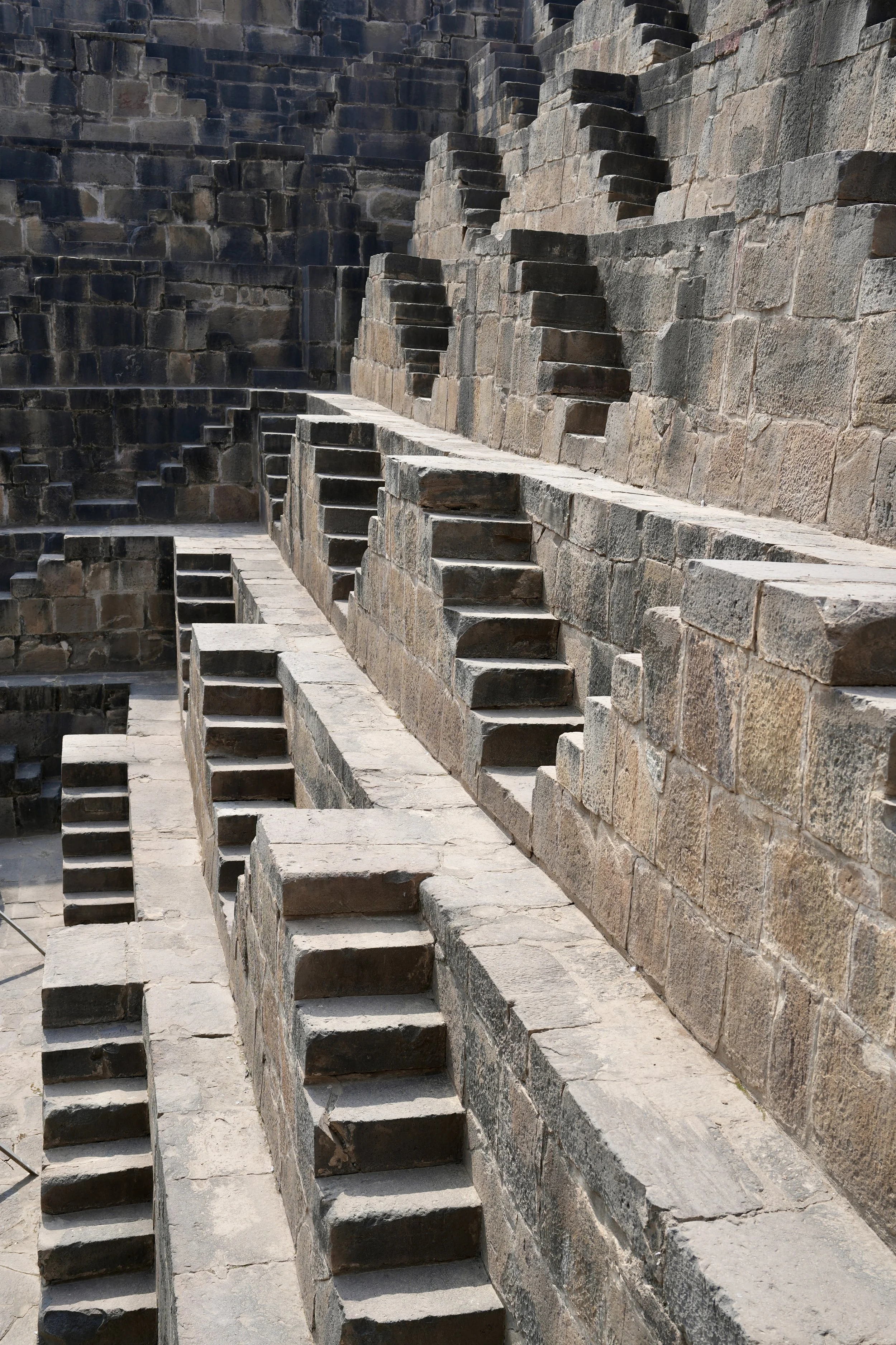 Steps of Chand Bawri stepwell Rajasthan with repeating zigzag staircase pattern
