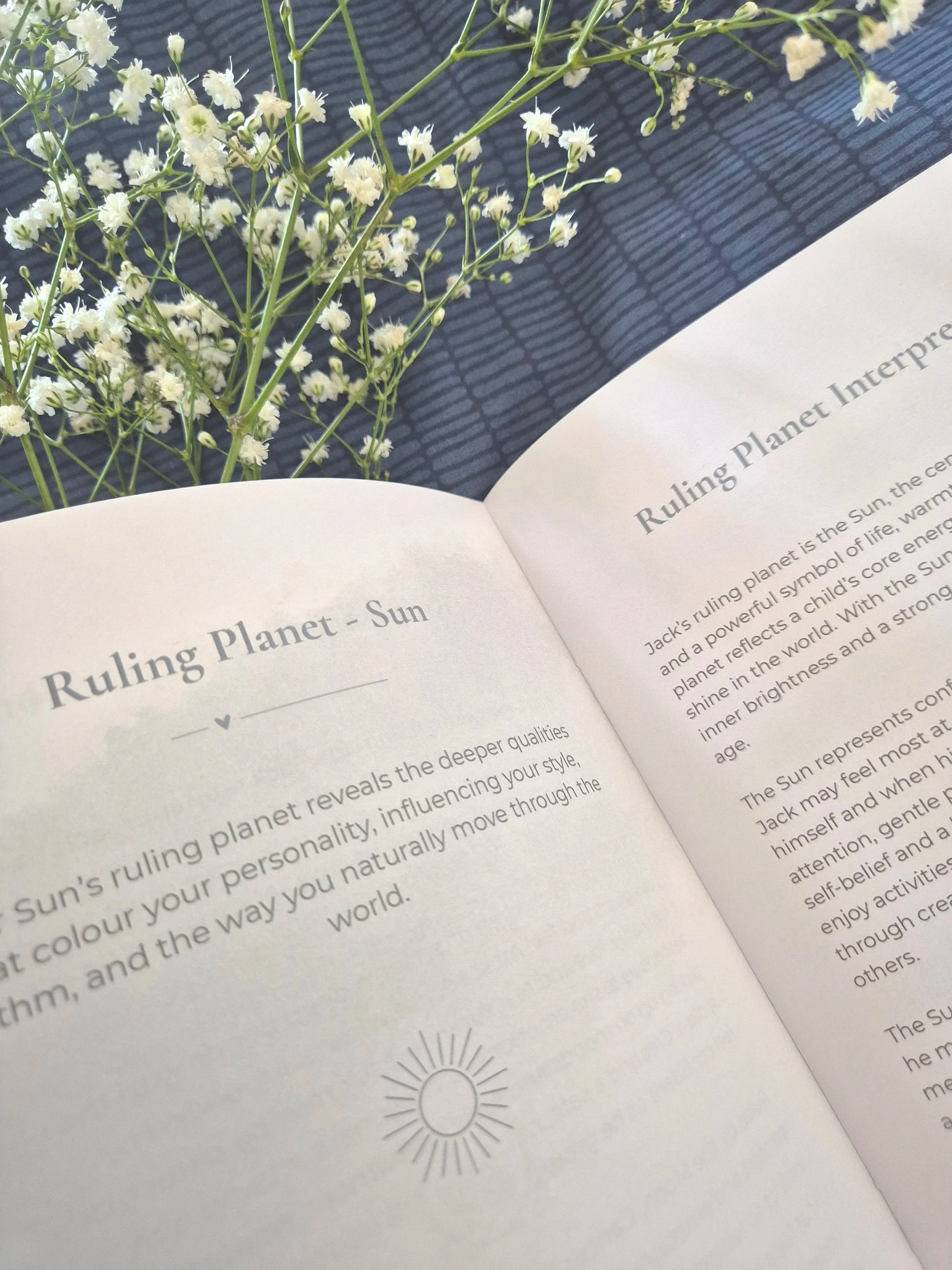 Open book showing the Ruling Planet page and interpretation on the opposite page.