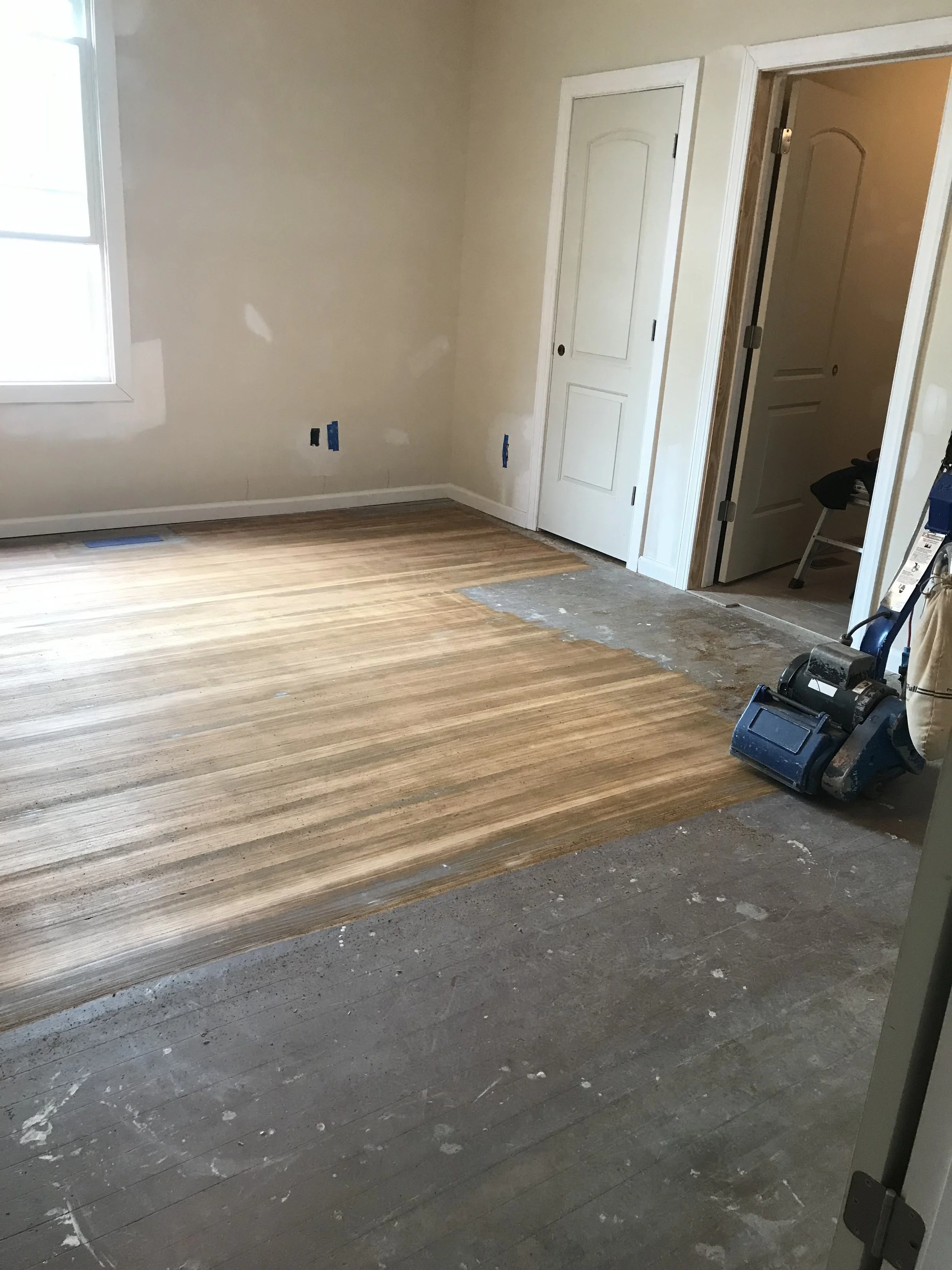 New flooring installation in progress inside a residential home during renovation.New flooring installation in progress inside a residential home during renovation.