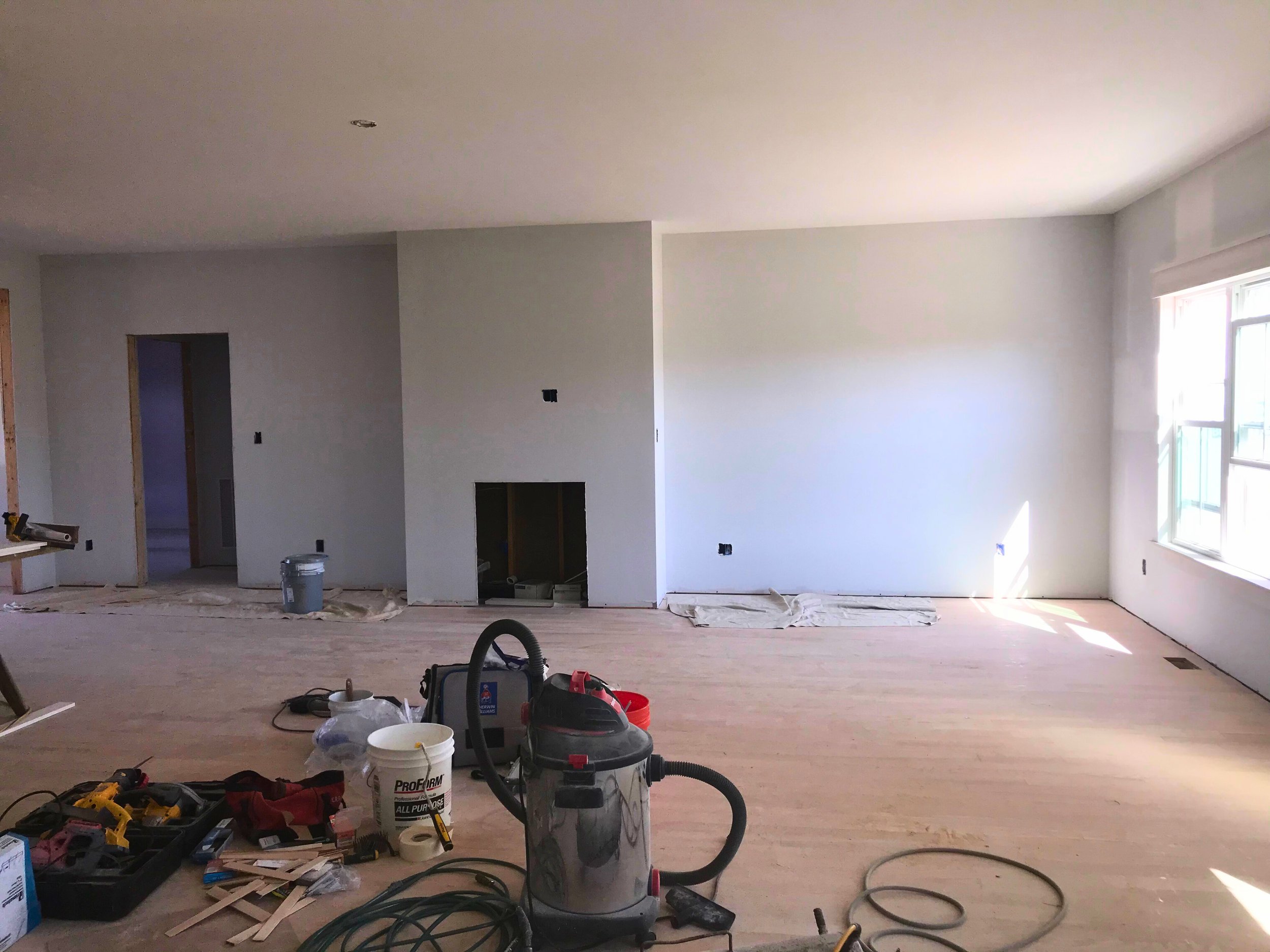 Interior room under renovation with unfinished walls and flooring inside a Danville, Virginia home.