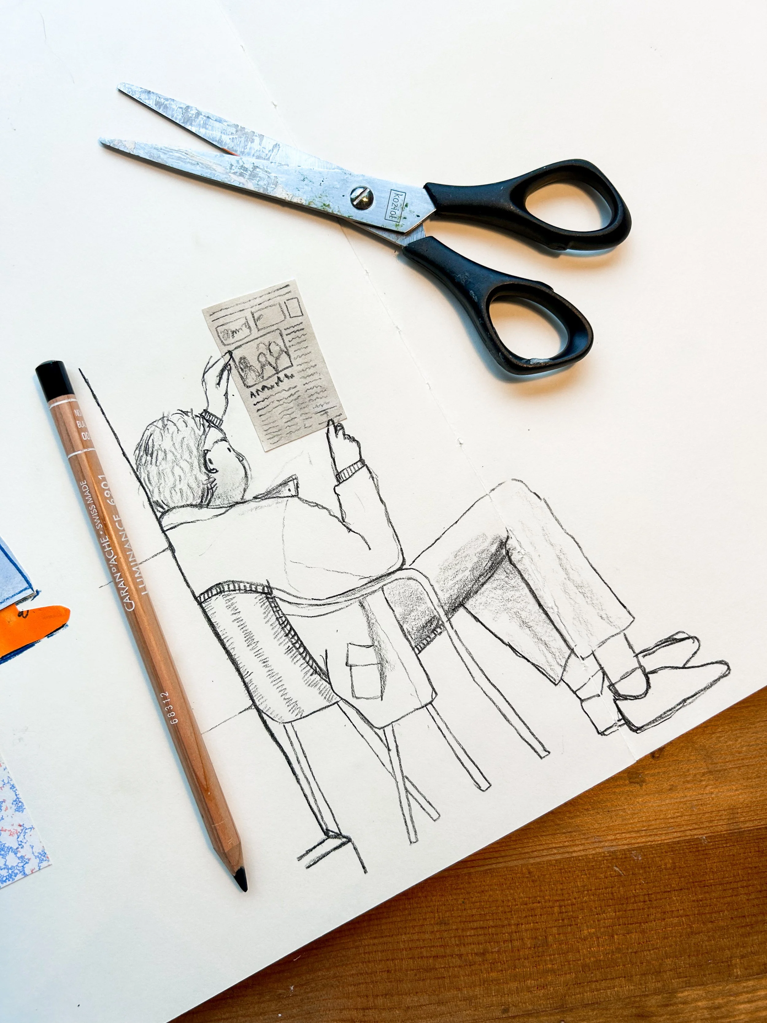 A sketch of a person sitting on a chair, reading a newspaper, with a pair of scissors and a brown pen placed on the paper, along with some small collage materials nearby.