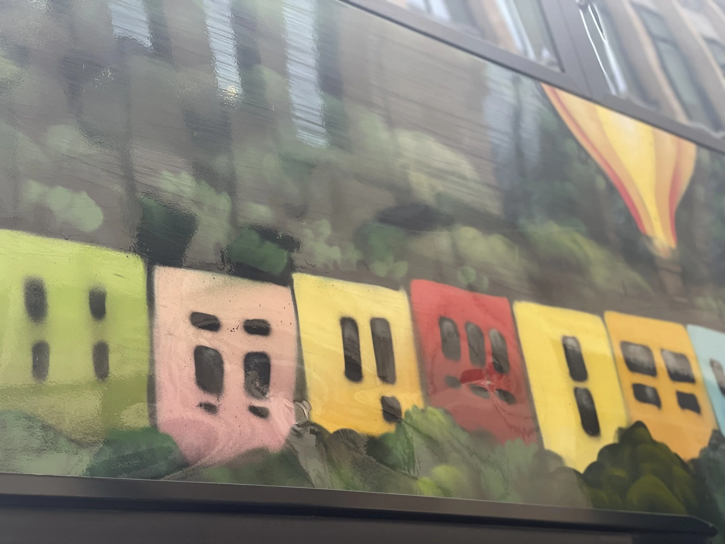 Bristol bus decorated with colourful houses
