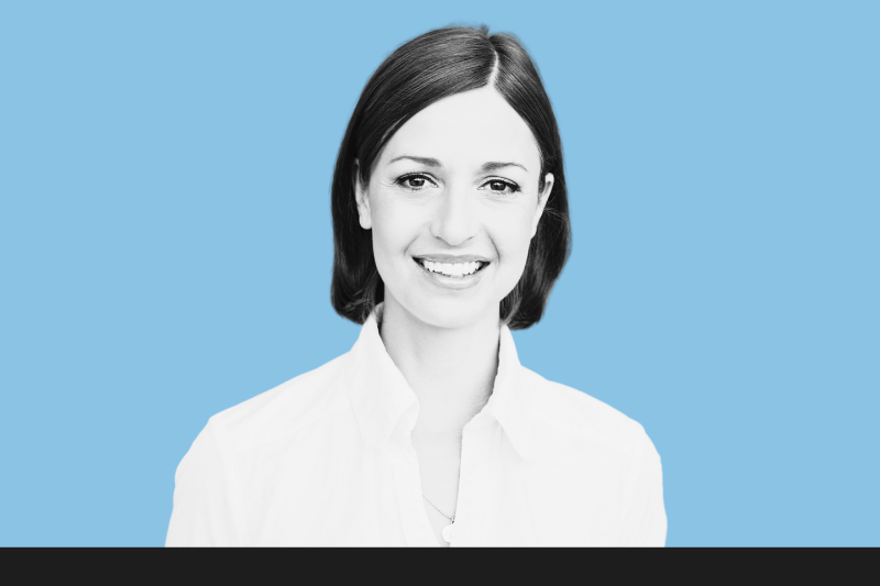 Portrait of smiling woman on blue background