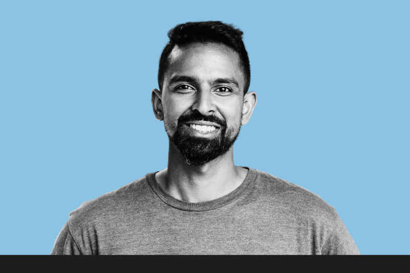 Portrait of smiling man on blue background