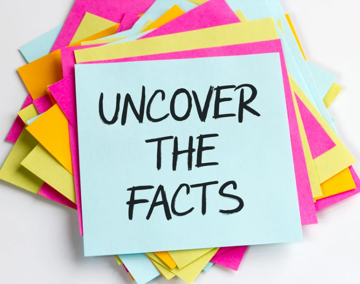 Stack of multicolored vibrant post-it notes with the phrase Uncover the Facts on the front