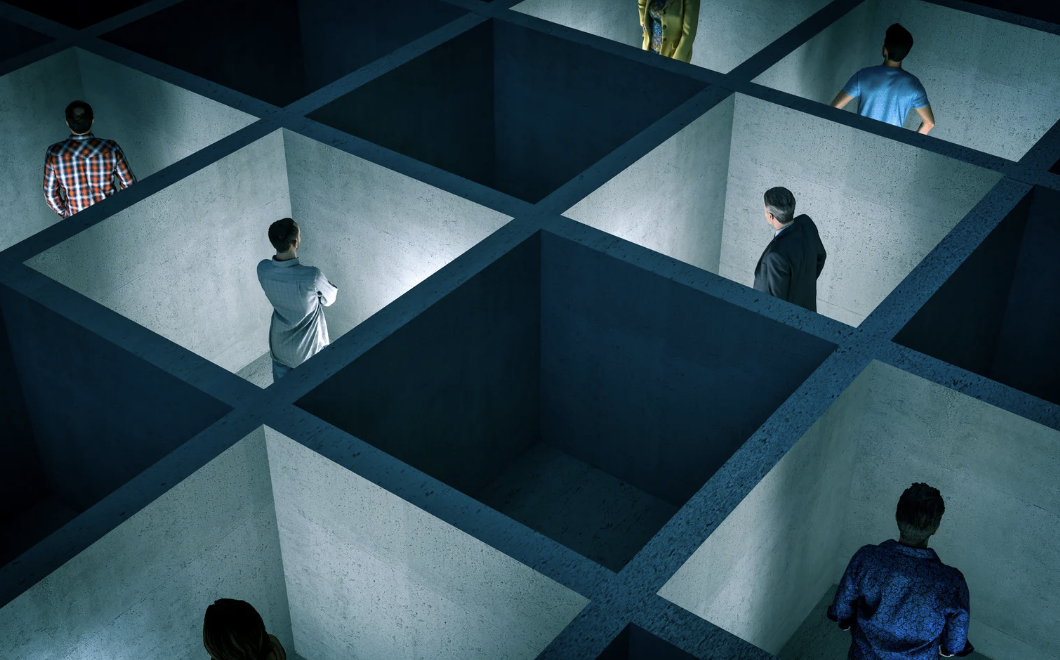 A concrete box with professionals trapped inside each one