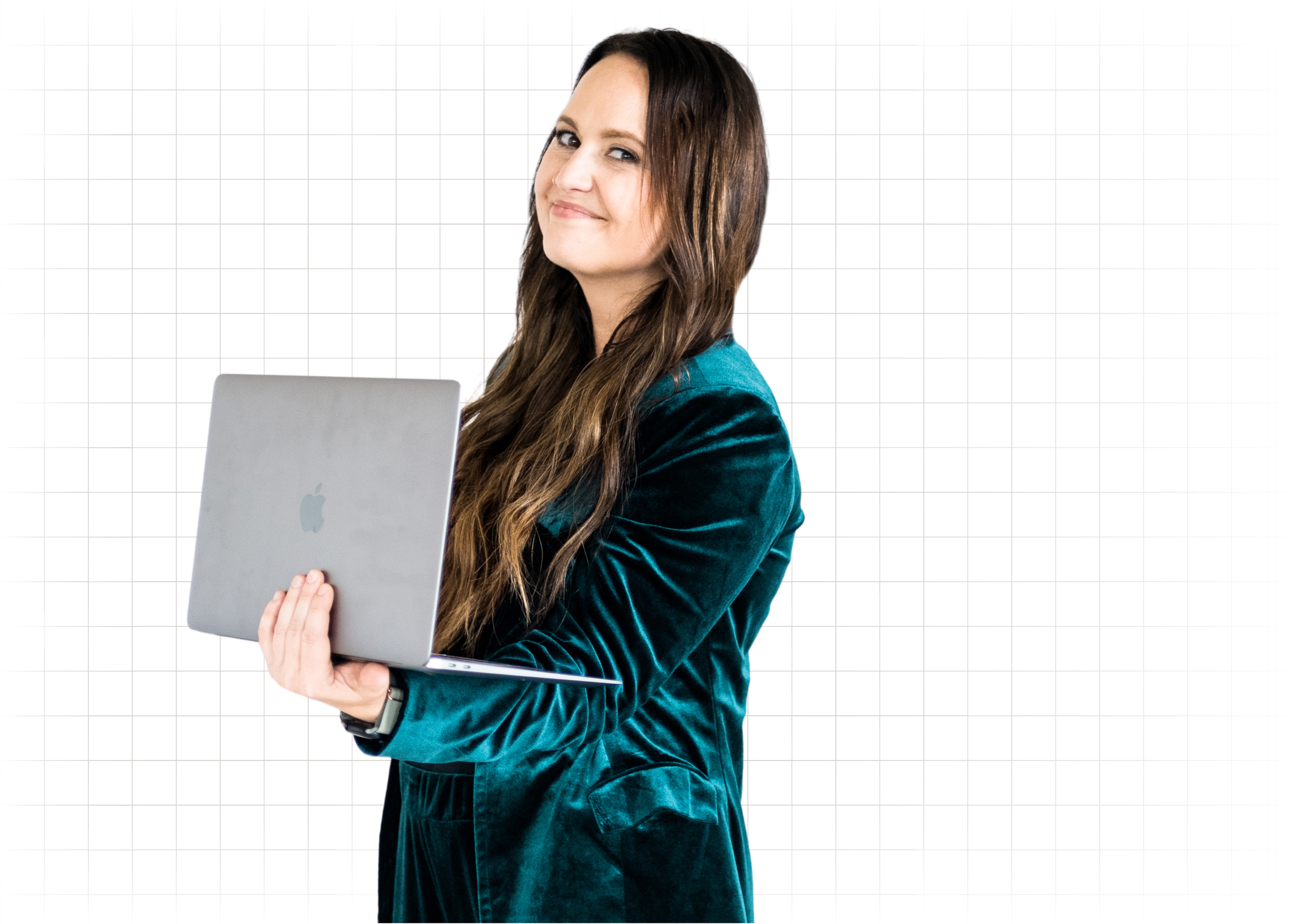 Rachel Bearbower of Nonprofit Automation Agency wearing a dark teal velvet blazer, holding an open silver MacBook laptop, standing and smiling at the camera against a white background with subtle grid lines.