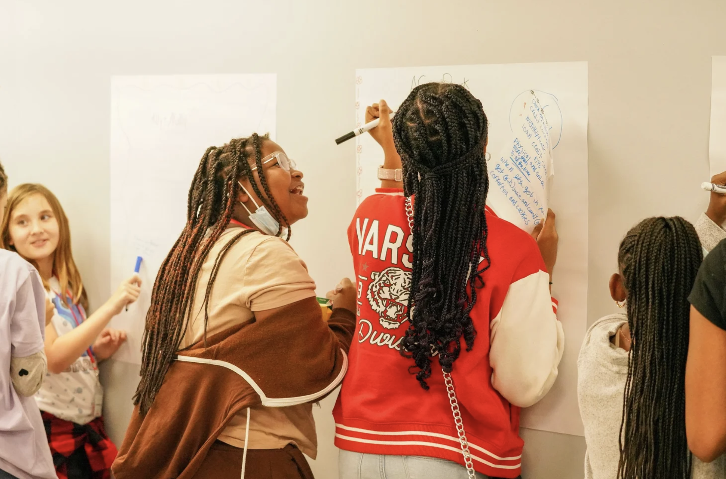 Students brainstorm for financial literacy workshop hosted by Pockets Change.