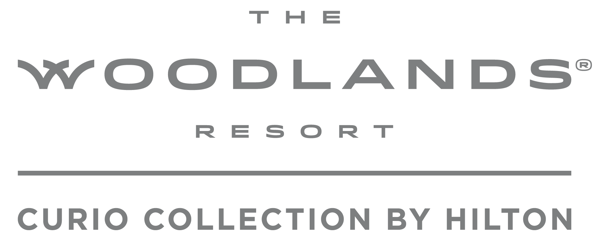 Logo for The Woodlands Resort, part of the Curio Collection by Hilton, in black and gray.