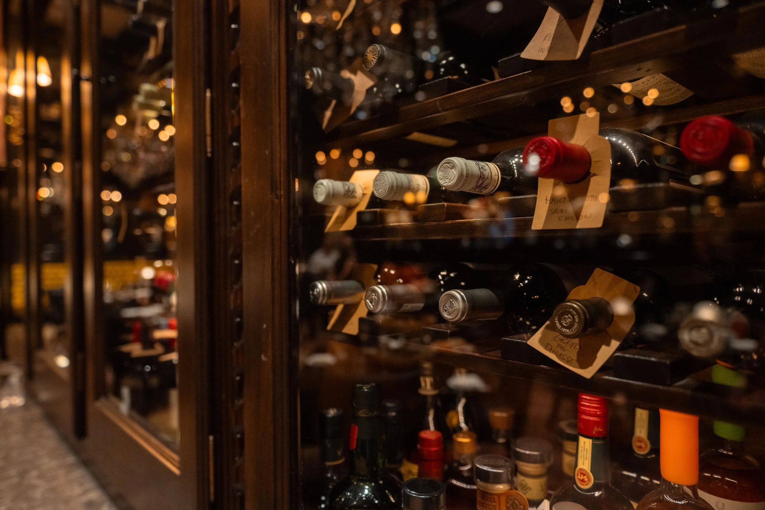 Wine display featuring a curated bottle selection at The Hemingway Steakhouse.