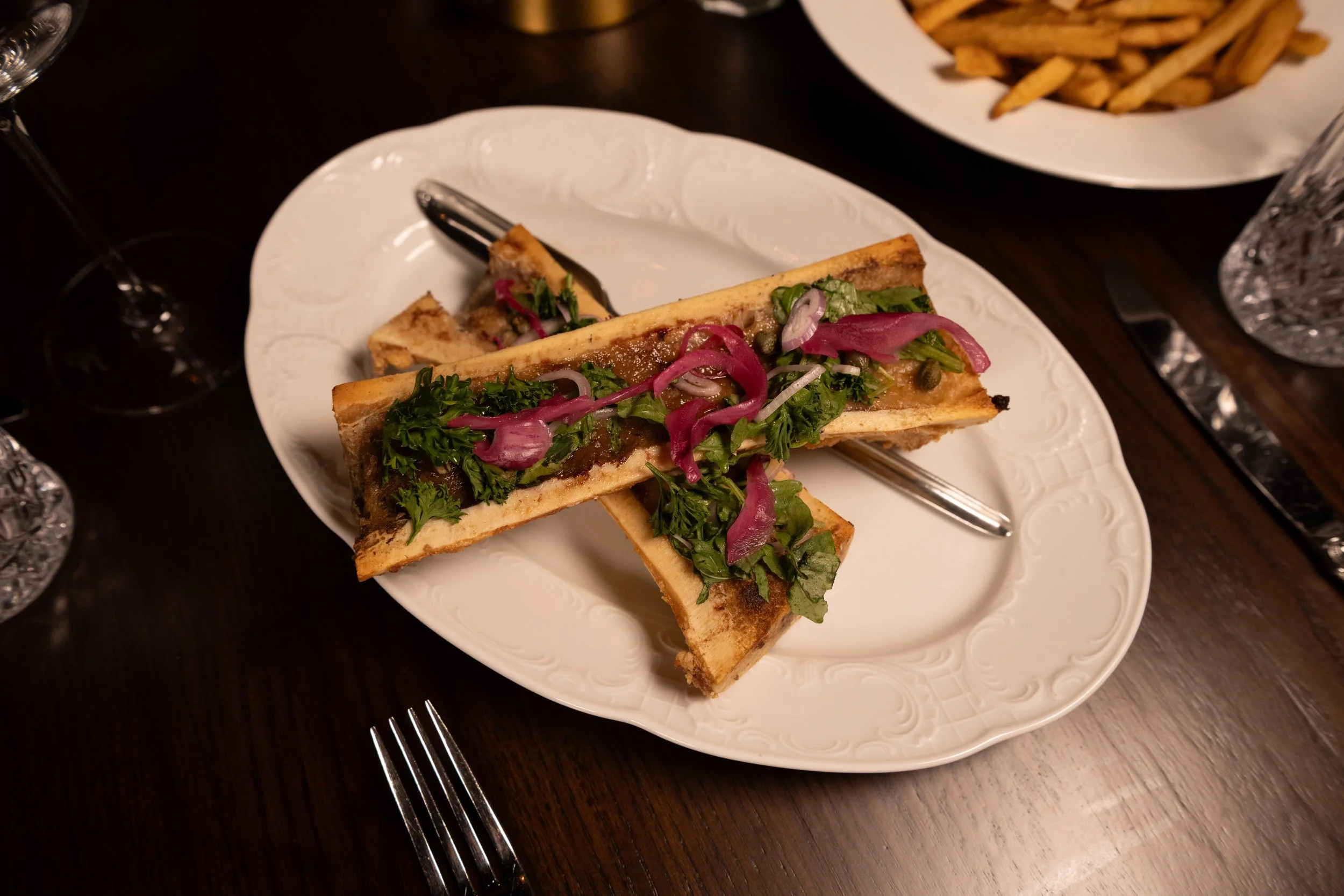 Beef tallow canoe served with house accompaniments at The Hemingway Steakhouse in Tulsa.