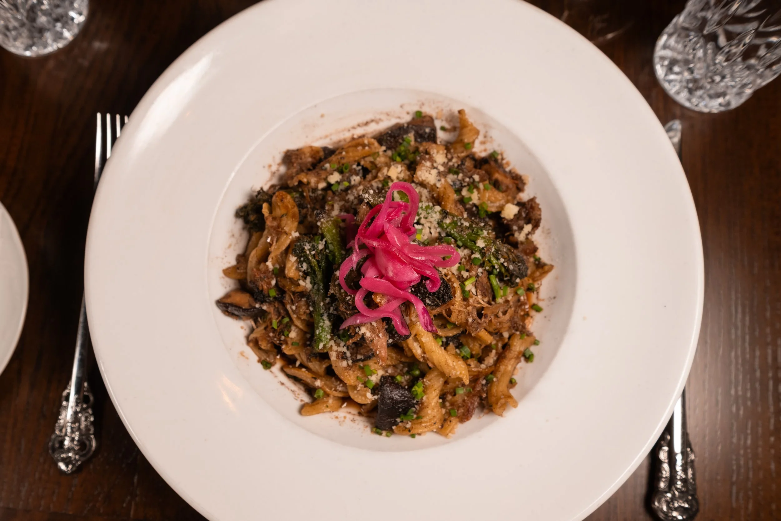 Freshly prepared pasta dish with herbs and cheese at The Hemingway Steakhouse.