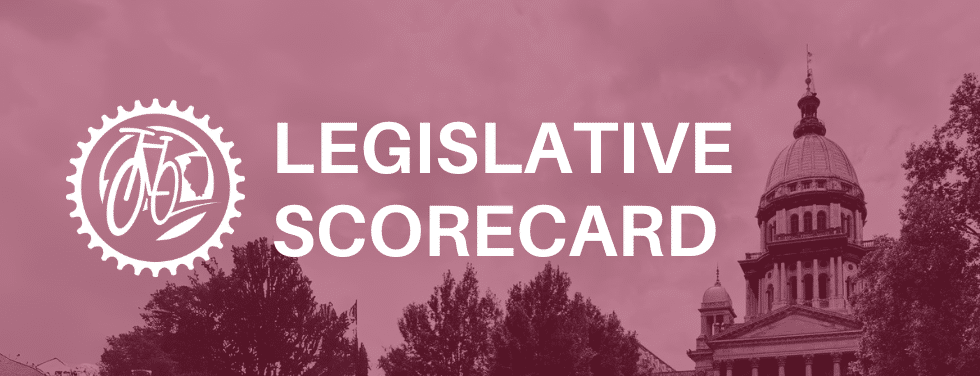 Banner with a red tinted background of the Illinois State Capitol building.  White text is on top of the background spelling "Legislative Scorecard", with Ride Illinois Logo on the left hand side.