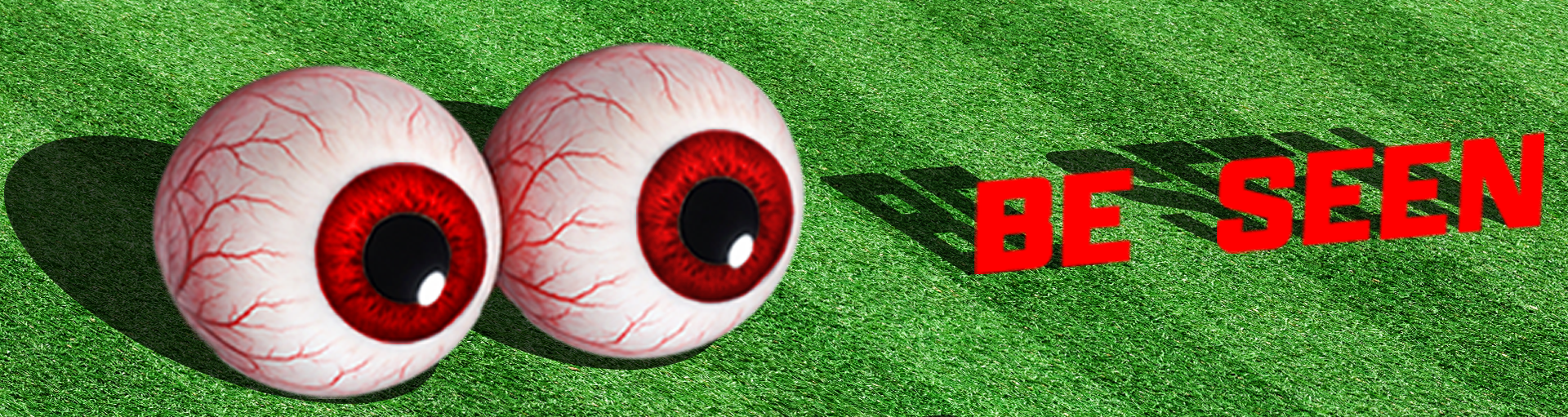 Two large, realistic-looking eyeballs with red irises and blood vessels on a green grassy surface. The eyeballs cast shadows, and the words "BE SEEN" are written in bold red letters to the right, with the shadow of the text visible on the grass.