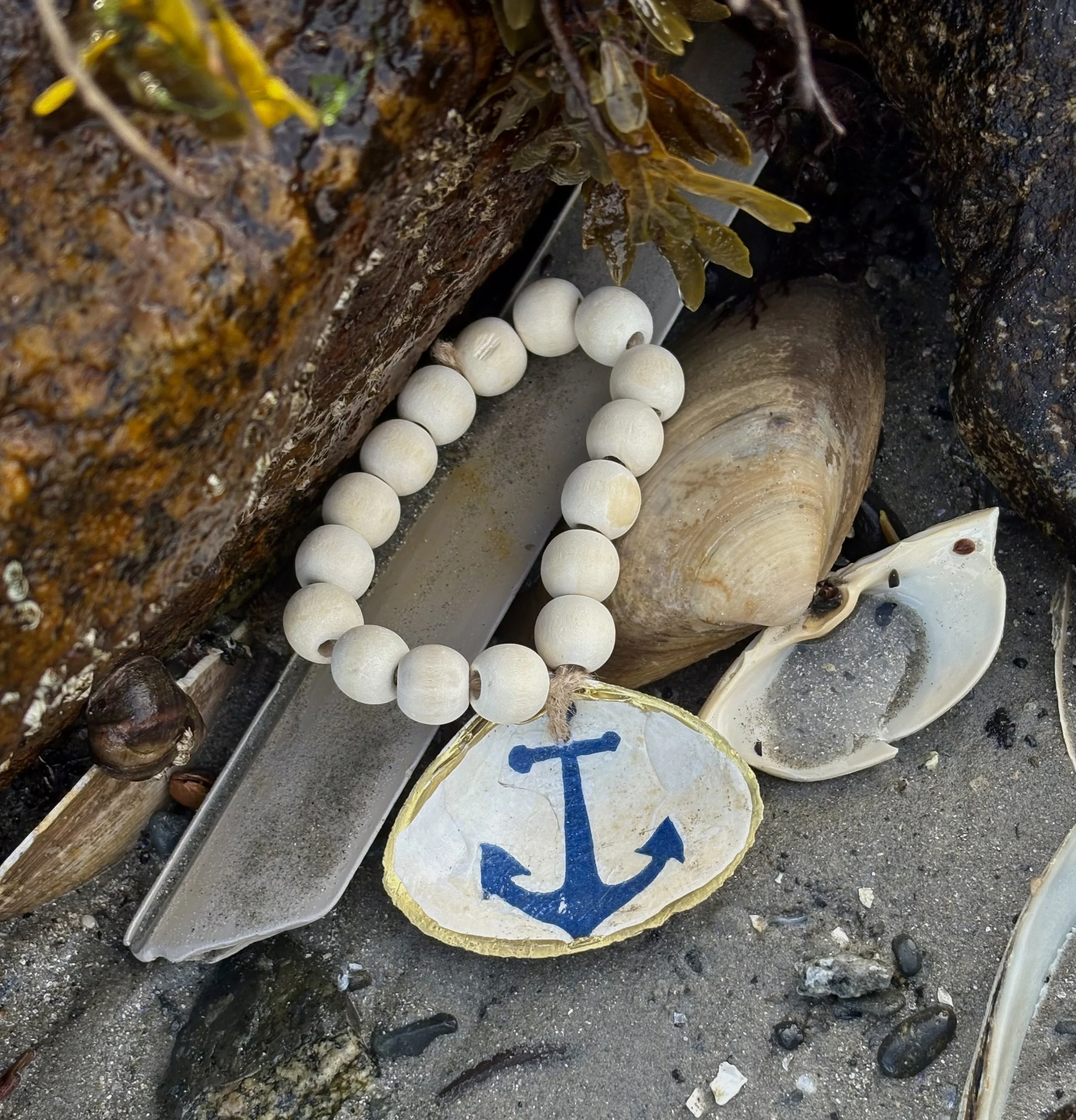 Anchor clam shell charm with natural bead collar