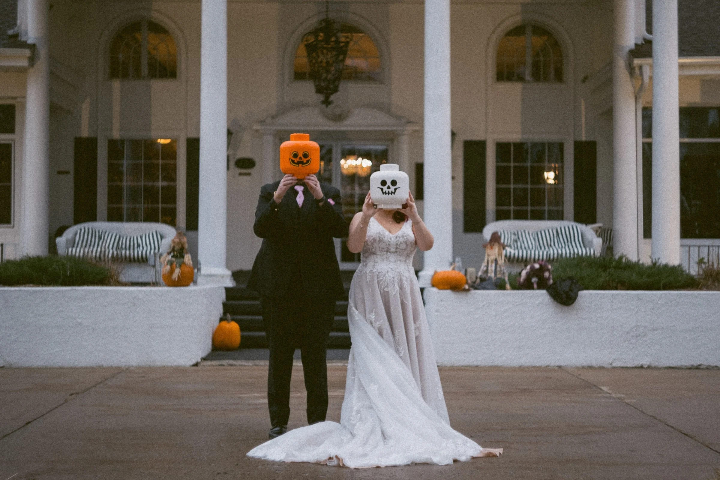 bride and groom hold lego heads over there faces at the Four Seasons Island Resort in Pembine, WI