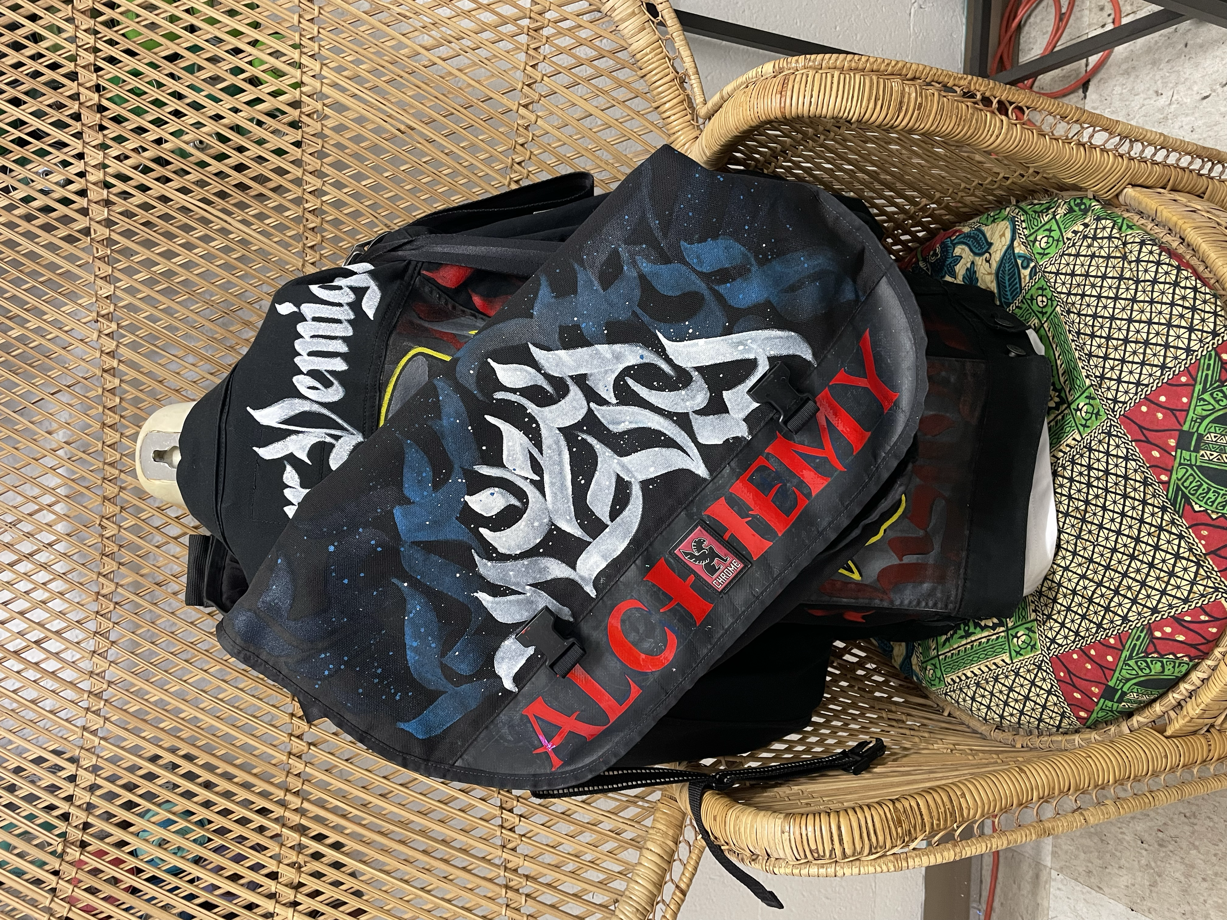 "Alchemy" - acrylic and enamel on Chrome messenger bag.