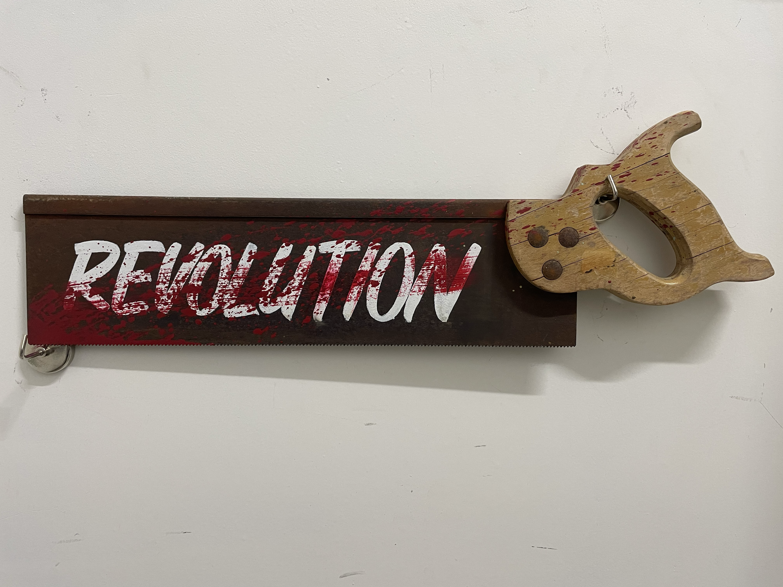 "Revolution" - enamel on rusted handsaw