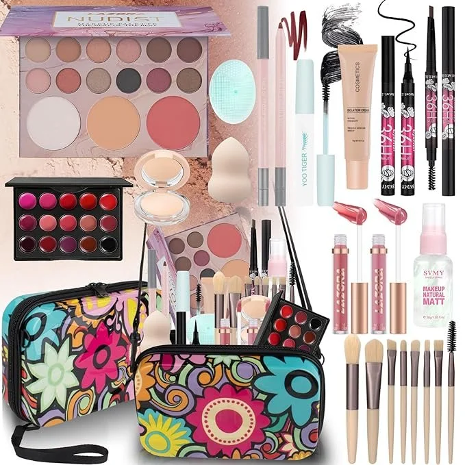 Collection of makeup products including eyeshadow palettes, brushes, lip glosses, eyeliners, foundation sponge, makeup bags, and various cosmetic items arranged on a surface.