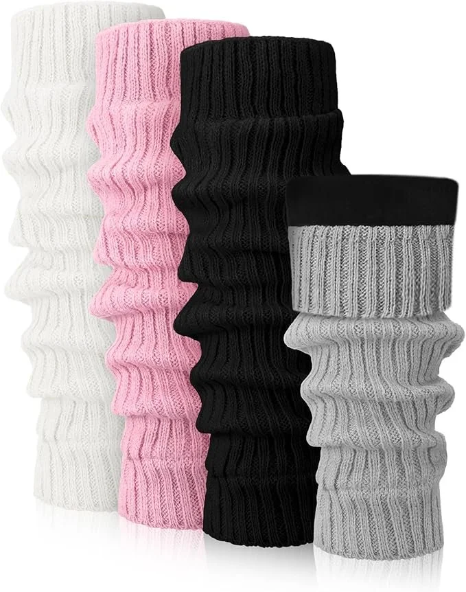 Stacked assorted cuffed knit socks in white, pink, black, and gray colors.