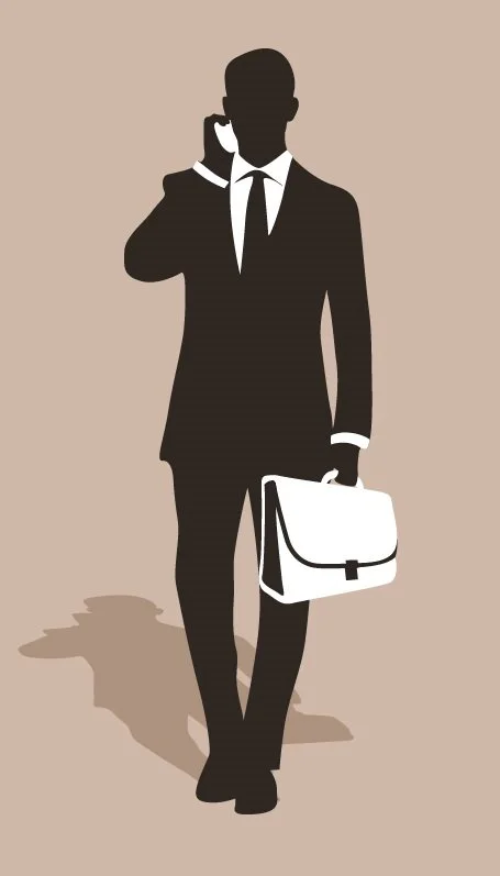 Silhouette of a man in a suit holding a briefcase and talking on a phone.