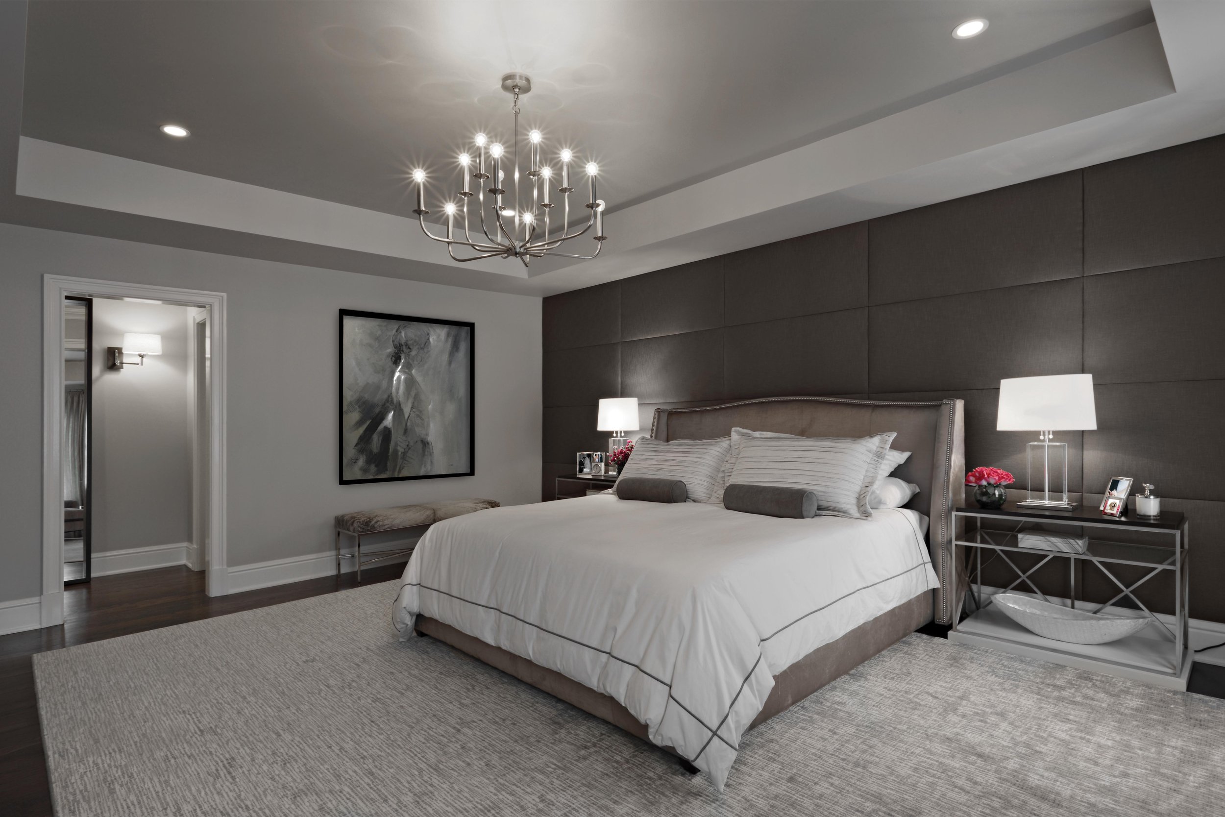 Primary bedroom in Parkfield House in Scarsdale NY home with upholstered wall and silver leaf ceiling treatment by Luminosus Designs.