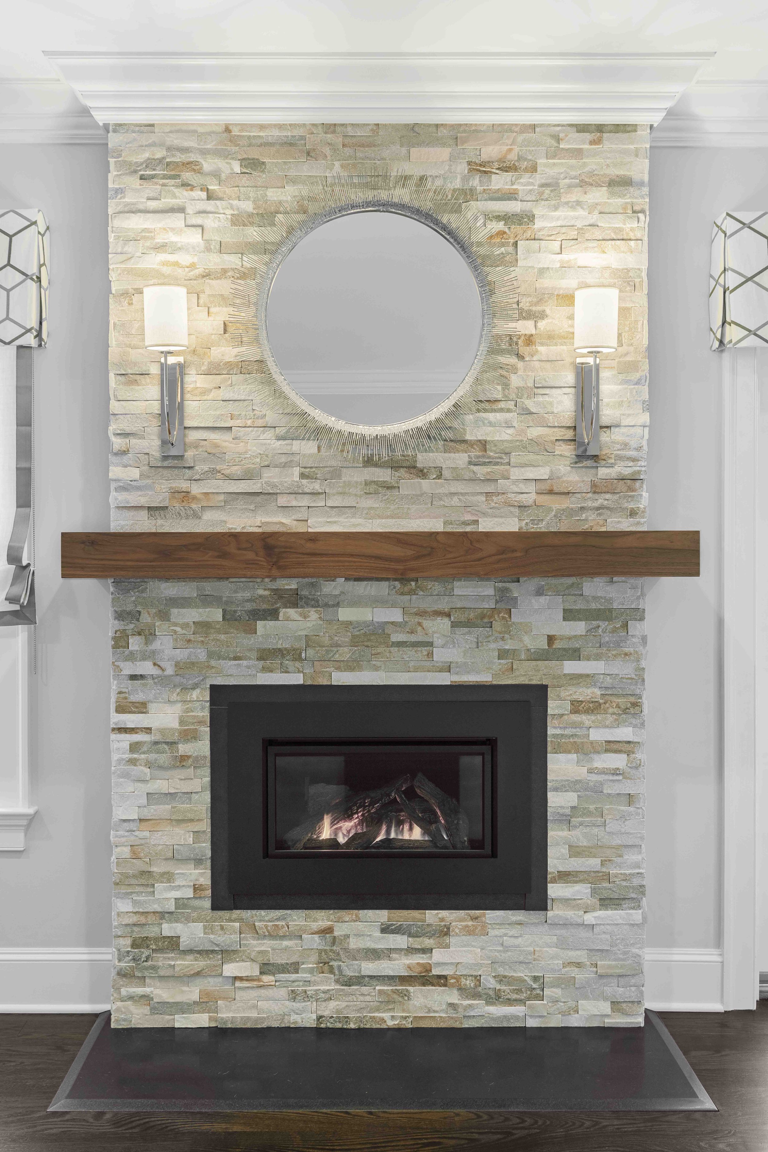 Close-up view of the fireplace and stone surround in the Glen Oaks family room in Rye NY.
