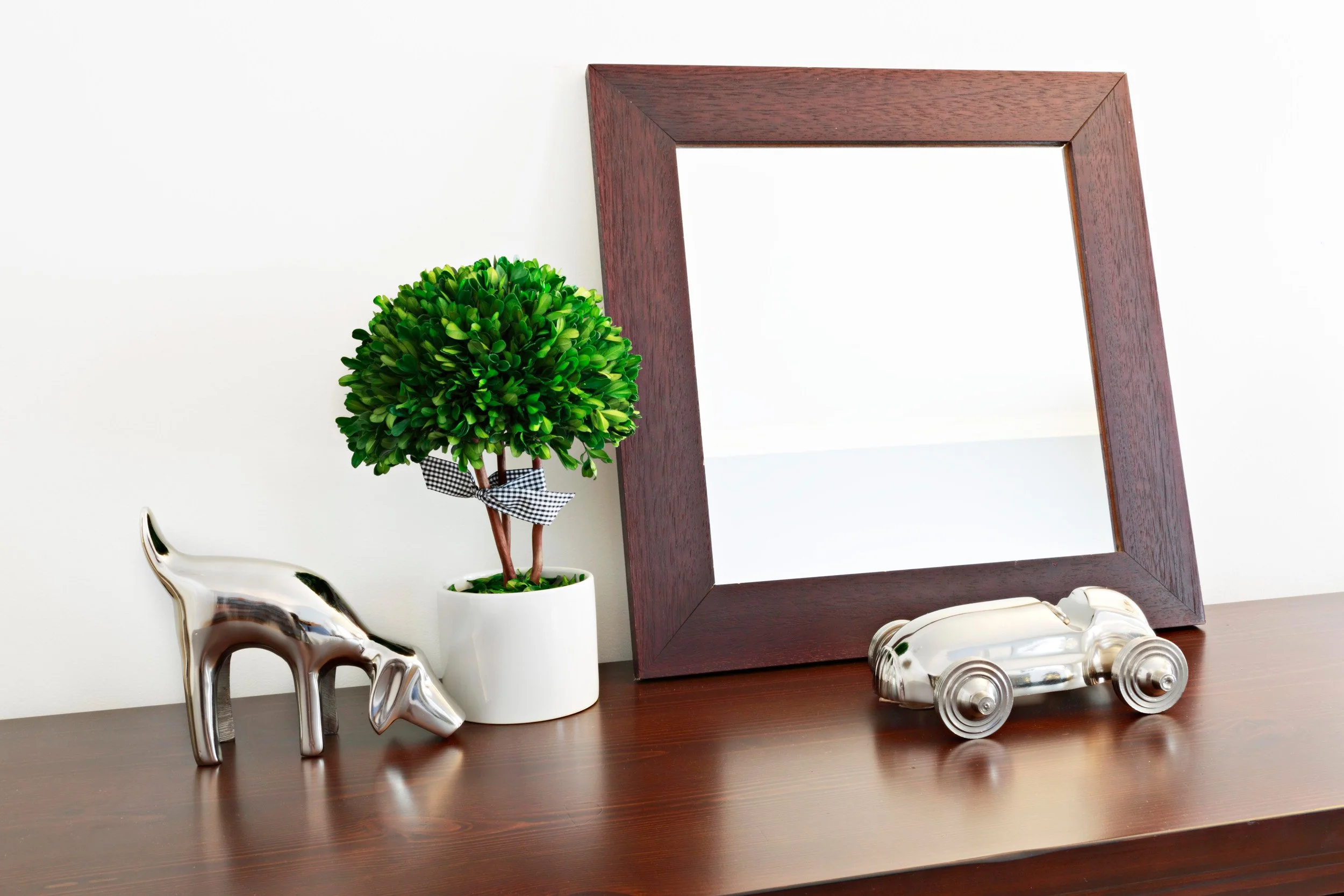 Styling detail in a boy’s bedroom for the Old Wagon project in Old Greenwich, CT featuring curated accessories and warm wood finishes.