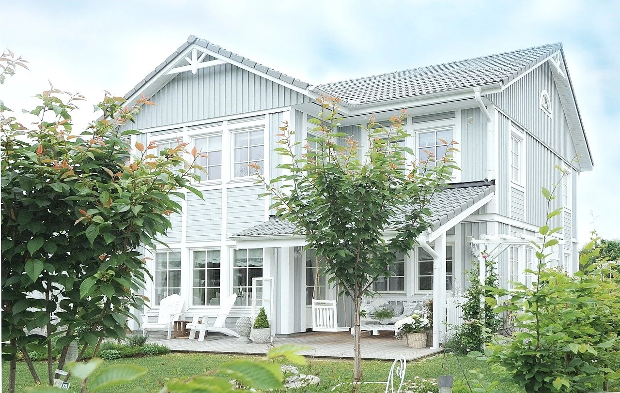 beautiful cape style beach house in pale blue and grey colors