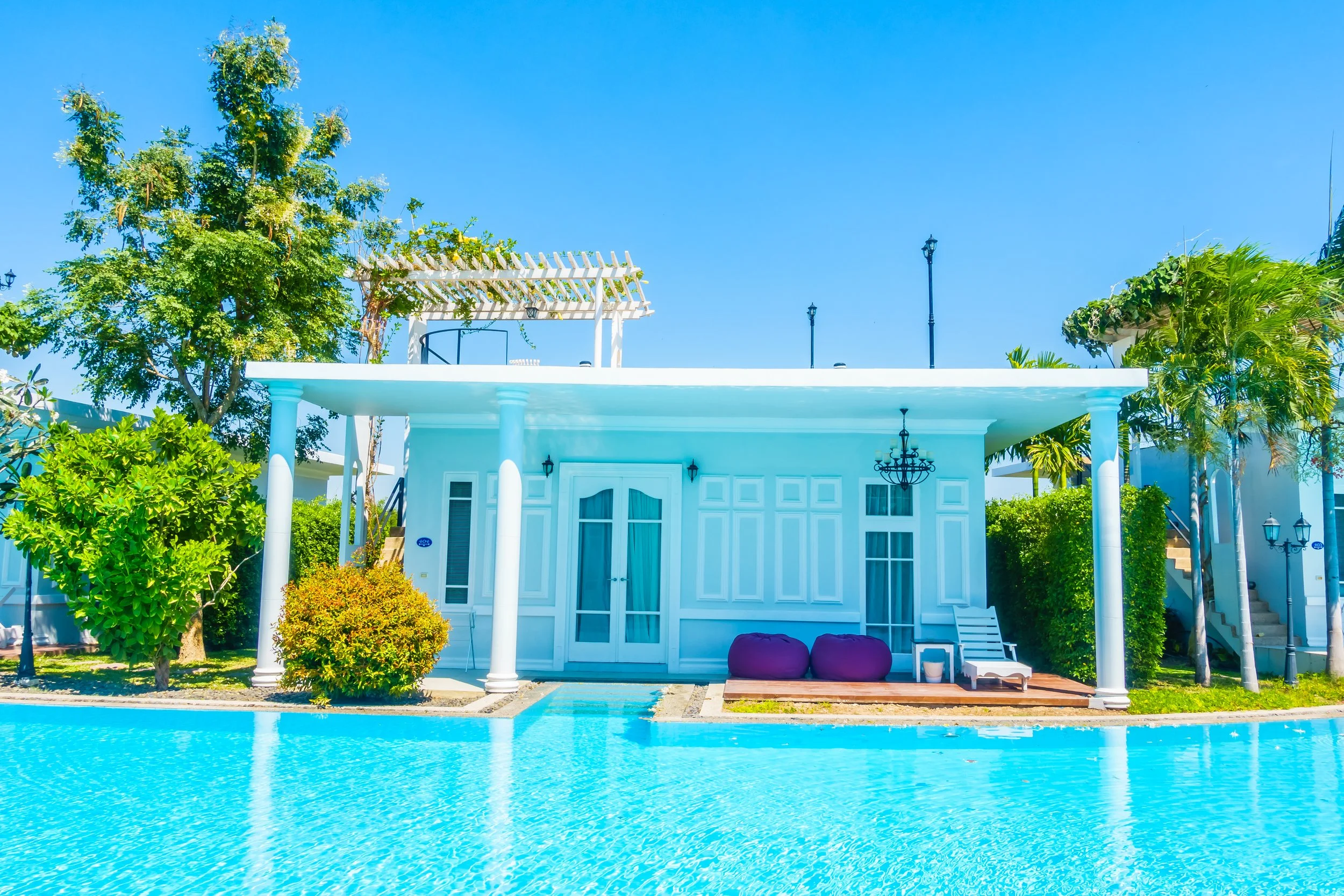 A serene blue house with white columns