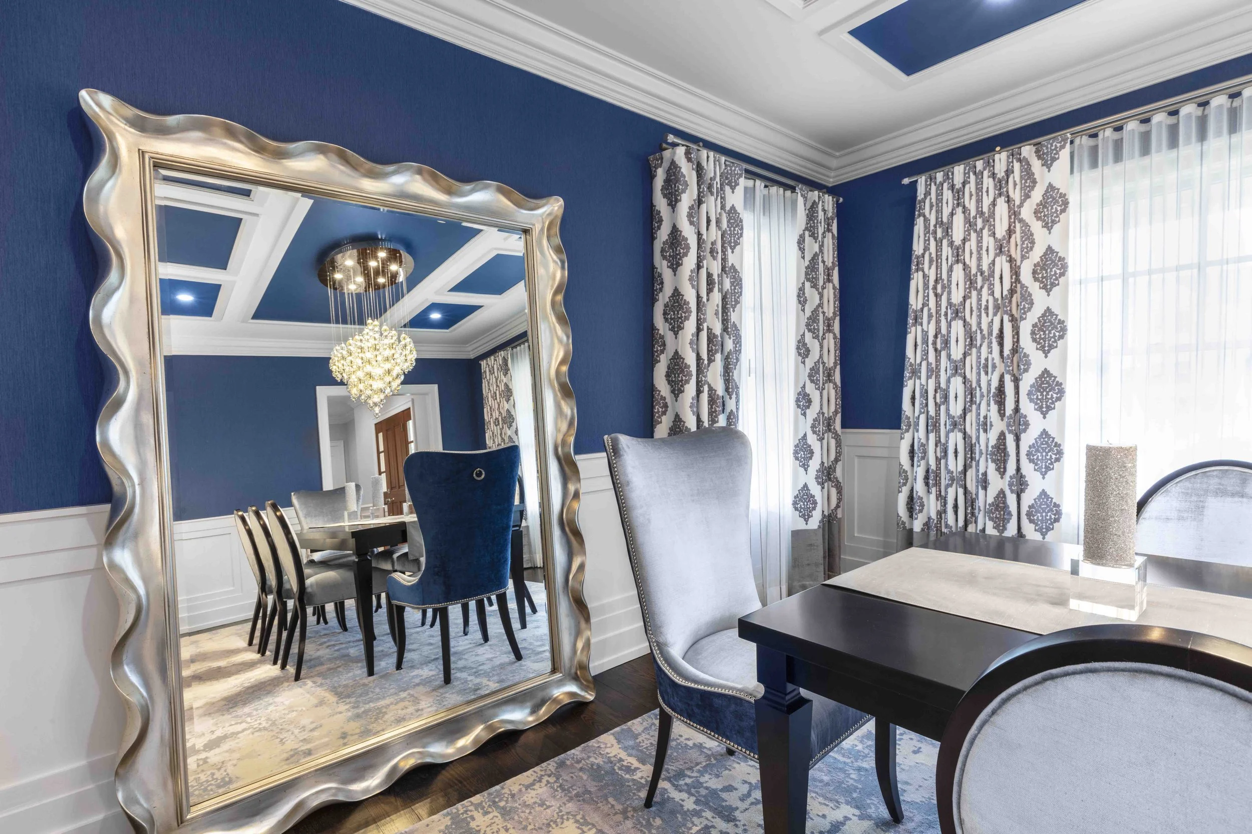 Close-up view of decorative floor mirror and window treatment in the Glen Oaks, Rye NY dining room, emphasizing scale, finish, and placement.
