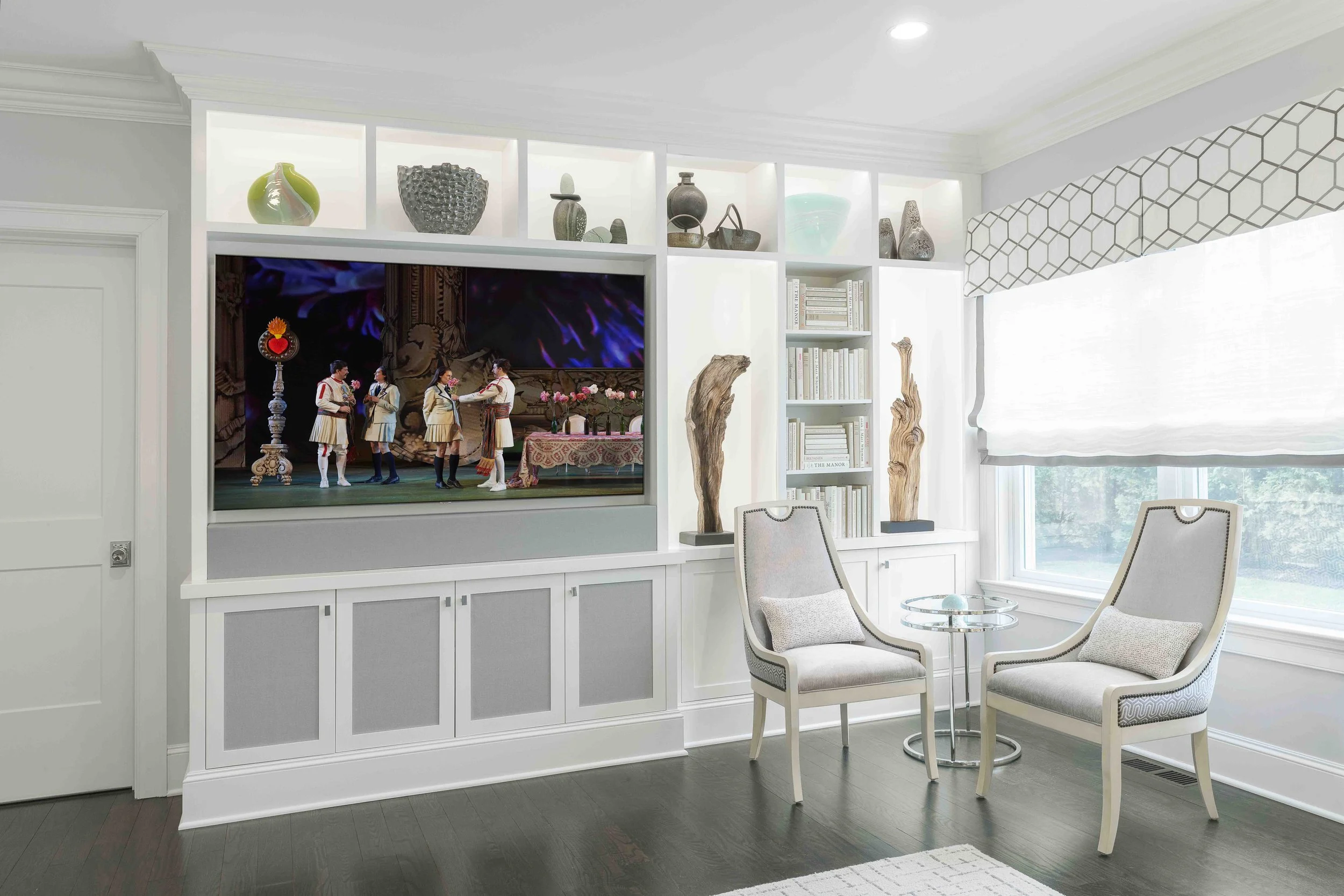 Close-up view of the media cabinet, and guest chairs in the Glen Oaks family room in Rye NY.