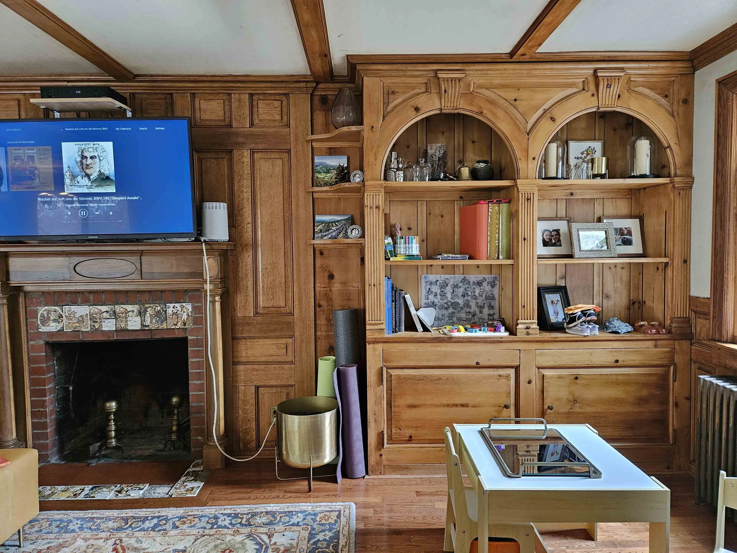 The existing fireplace had presence, but the surrounding materials made the room feel heavier and more dated than it needed to be.