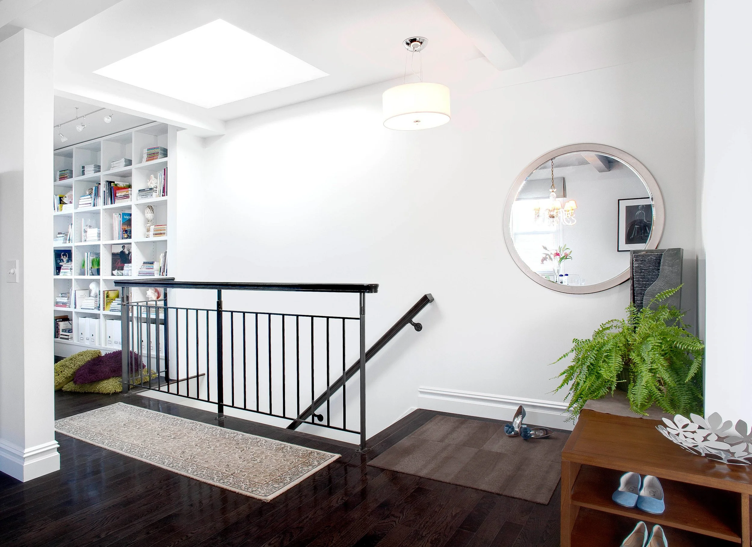 Wide view of staircase and skylight at the Muliner House in Bronx, NY.
